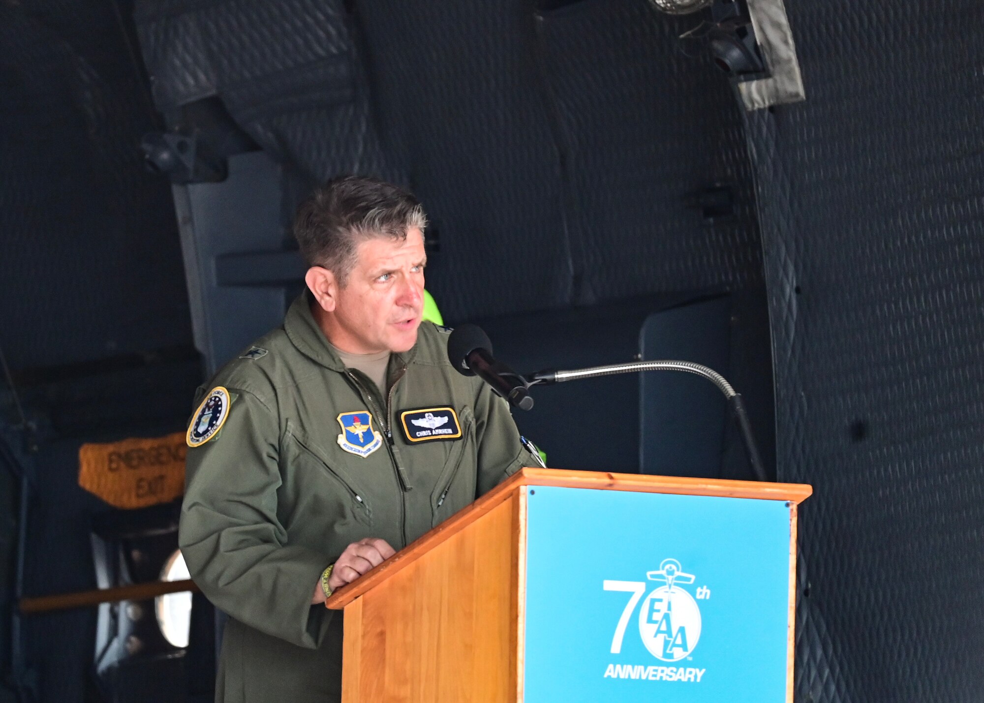 Brig. Gen. Christopher Amrhein, Air Force Recruiting Service commander, speaks during an Honor Flight Welcome Home event at EAA Air Venture Oshkosh, in Oshkosh, WI, July 28, 2023.