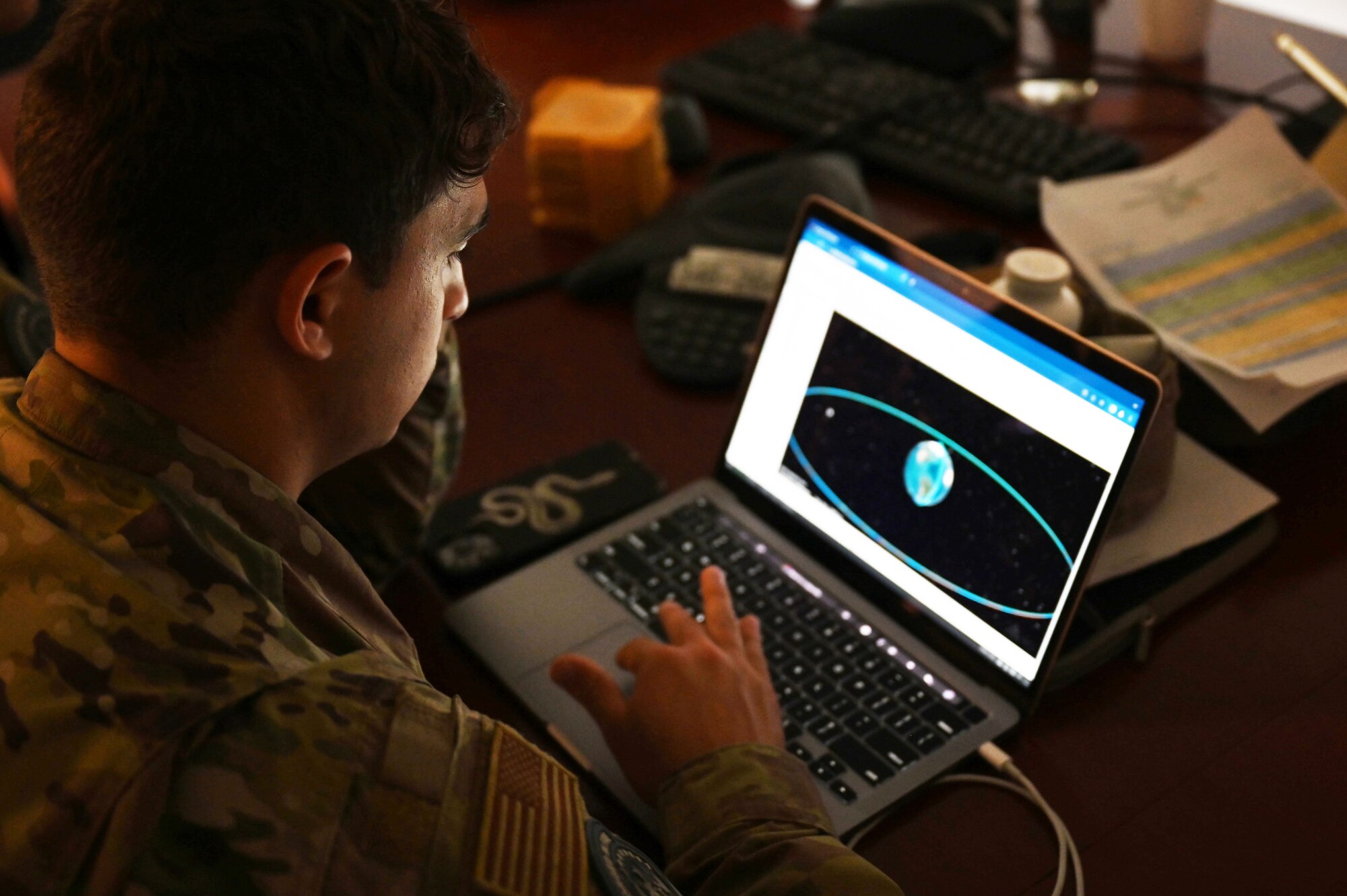 Senior Airman Capostagno looks through information on his laptop during the Vulcon Guard Bolt 5 exercise