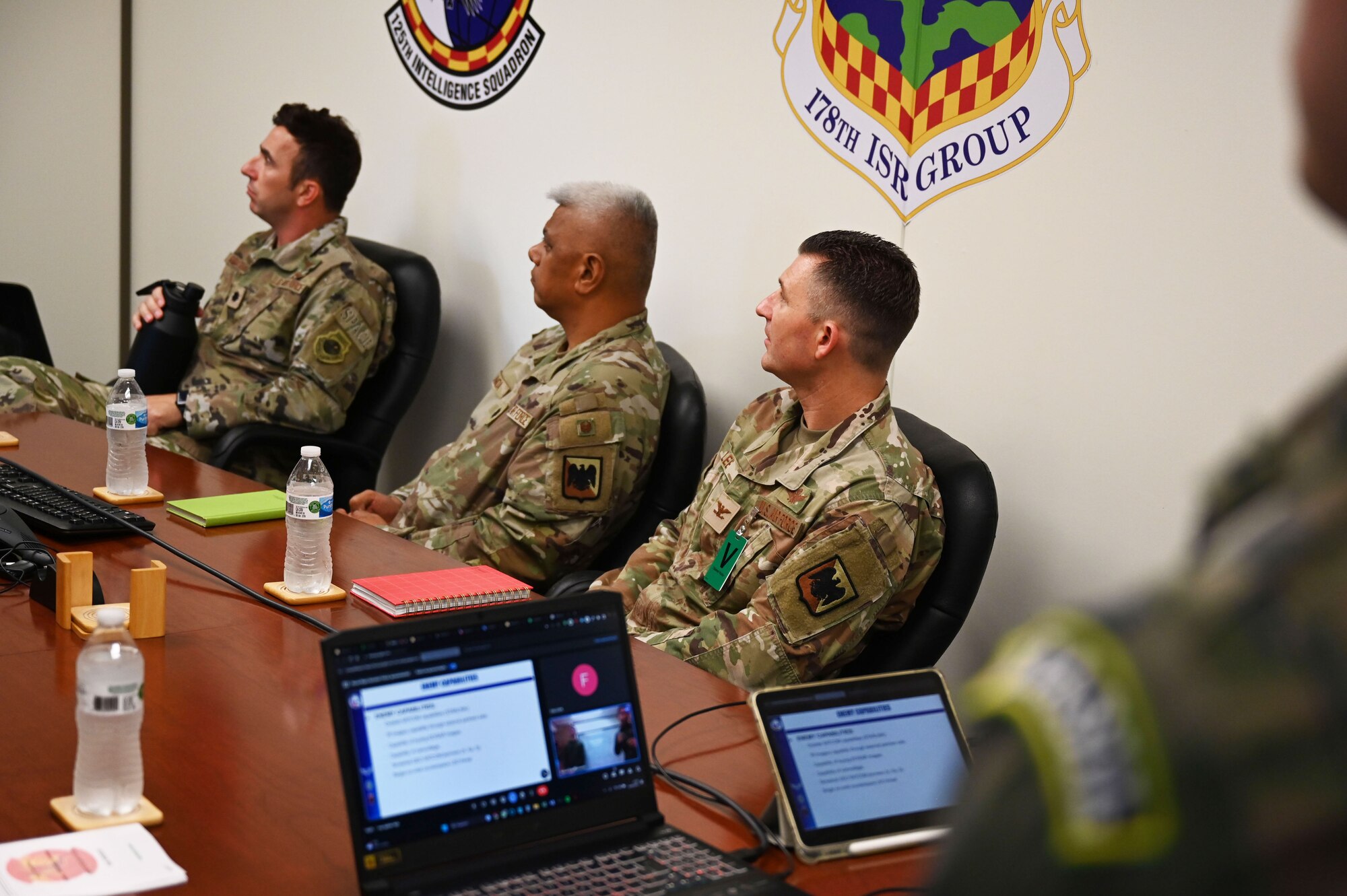 Leadership watches the most recent development of the Vulcan Guard exercise.
