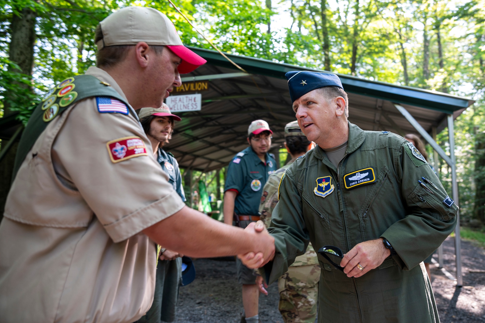U.S. Air Force Brig. Gen. Christopher Amrhein, Air Force Recruiting Service commander, meets Boy Scouts of America staff and camp counselors at Camp Minsi in Pocono Summit, Penn., July 22, 2023.