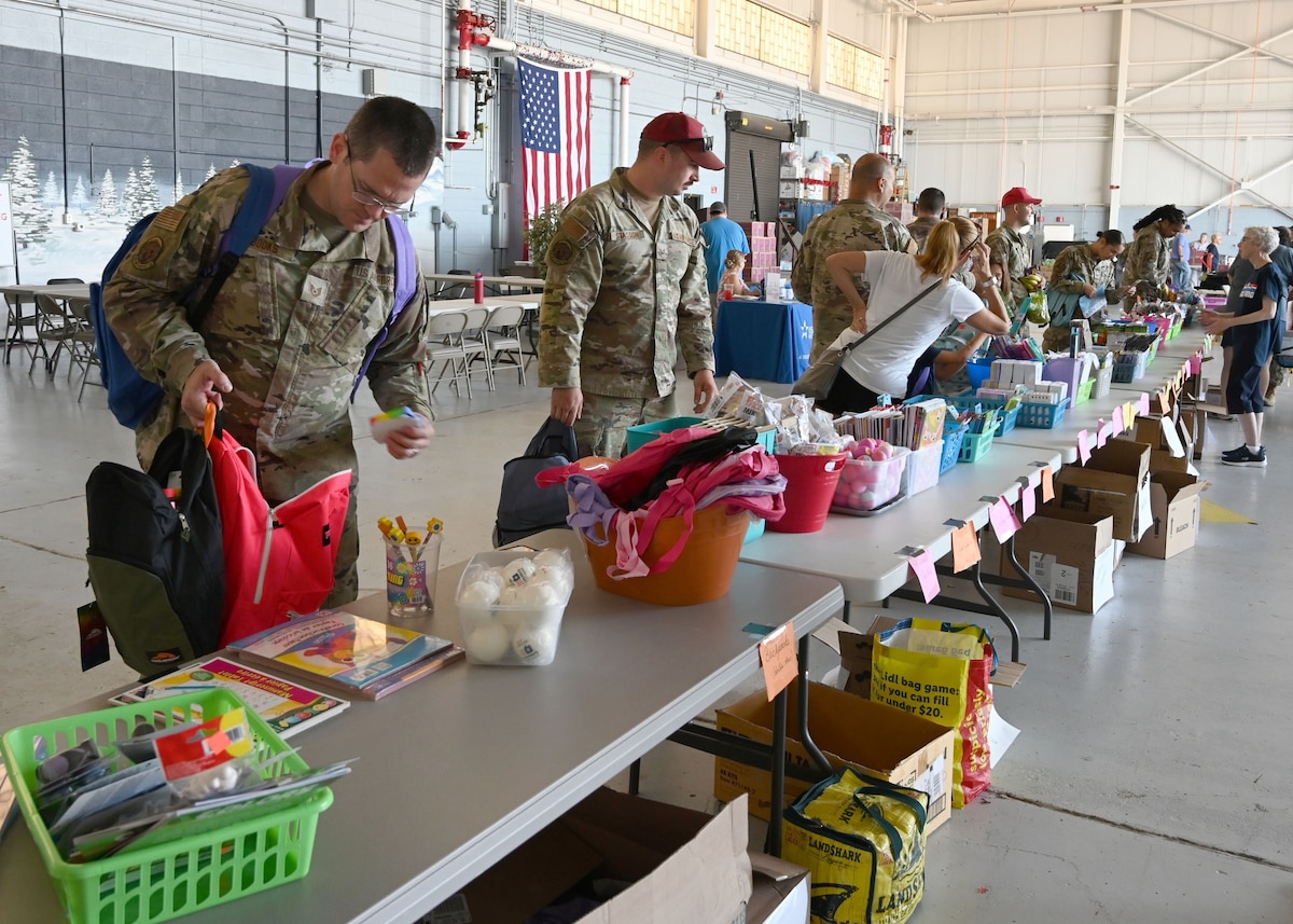 Men and women line up at tables.