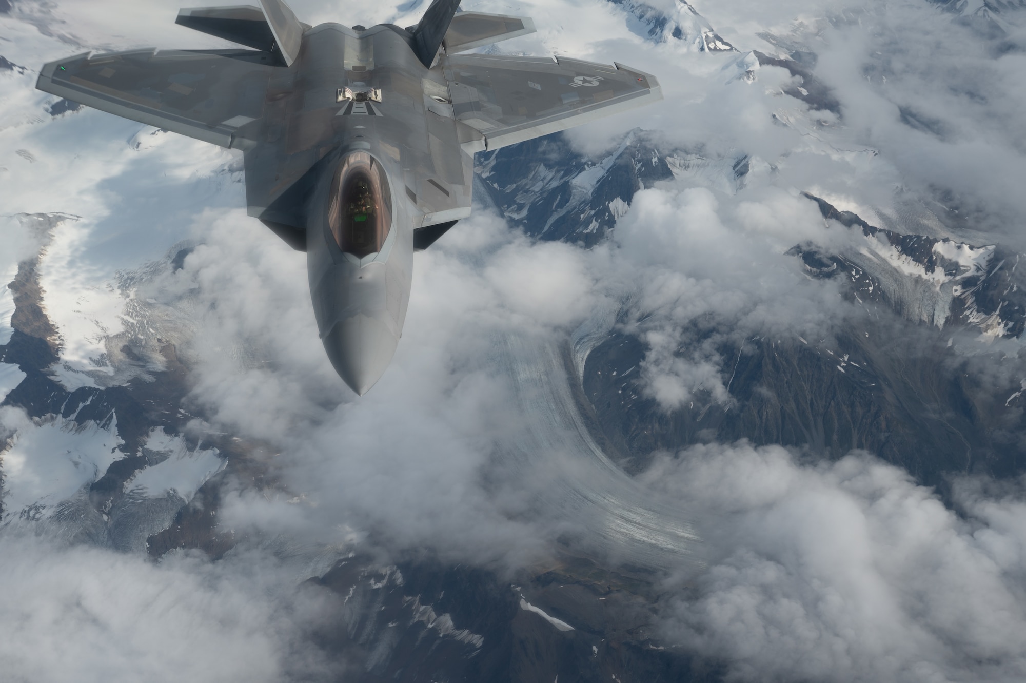 A U.S. Air Force F-22 Raptor assigned to the 3rd Wing at Joint Base Elmendorf-Richardson flies in for a refueling from a KC-135 Stratotanker assigned to the 168th Air Refueling Squadron over Joint Pacific-Alaska Range Complex during Red Flag-Alaska 23-3, Aug. 15, 2023.
