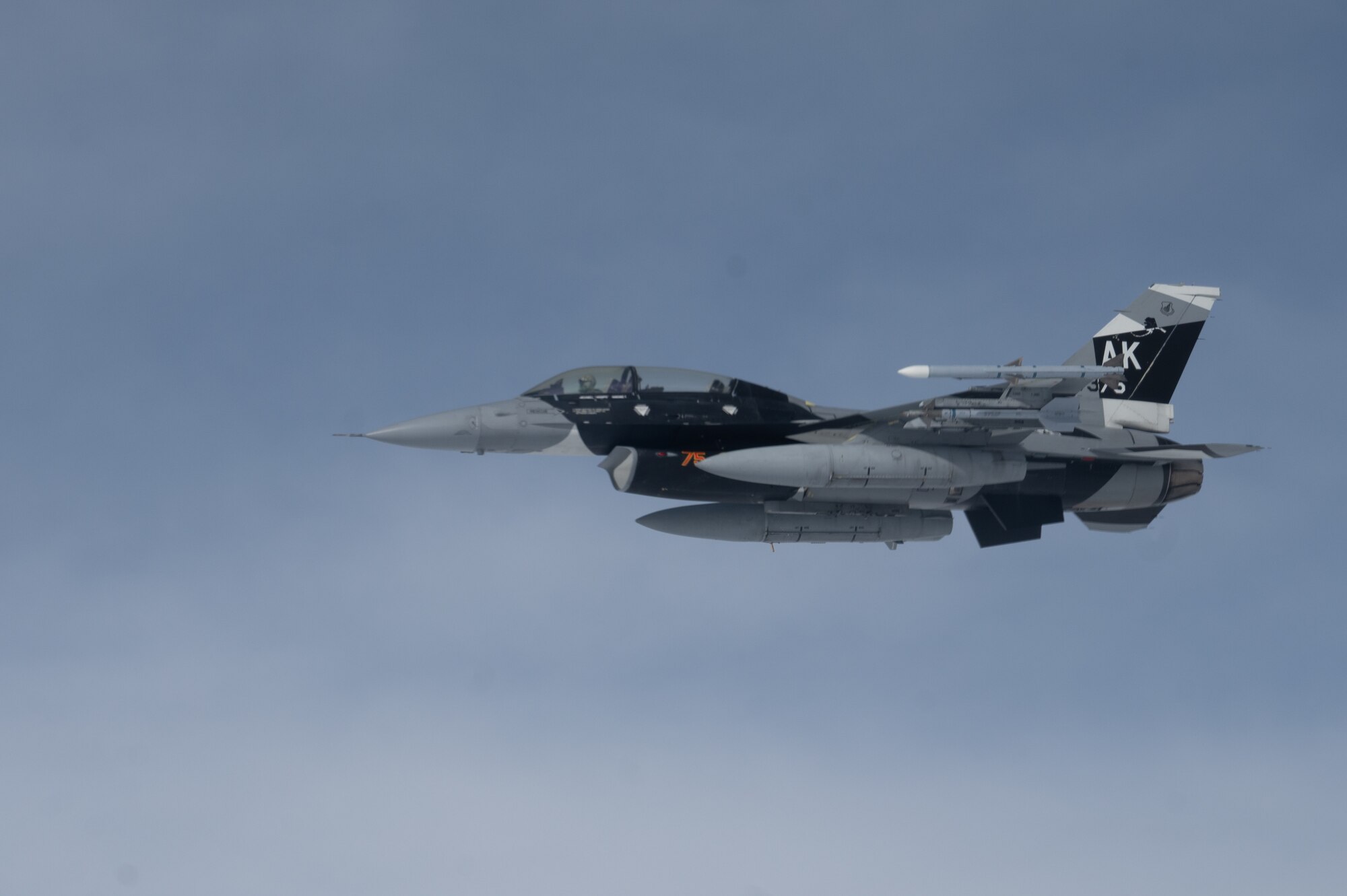 U.S. Air Force F-16 Fighting Falcon, assigned to the 18th Aggressor Squadron, Eielson Air Force Base, awaits refueling from a KC-135 Stratotanker assigned to the 168th Air Refueling Squadron over the Joint Pacific-Alaska Range Complex during Red Flag-Alaska 23-3, Aug. 15, 2023.