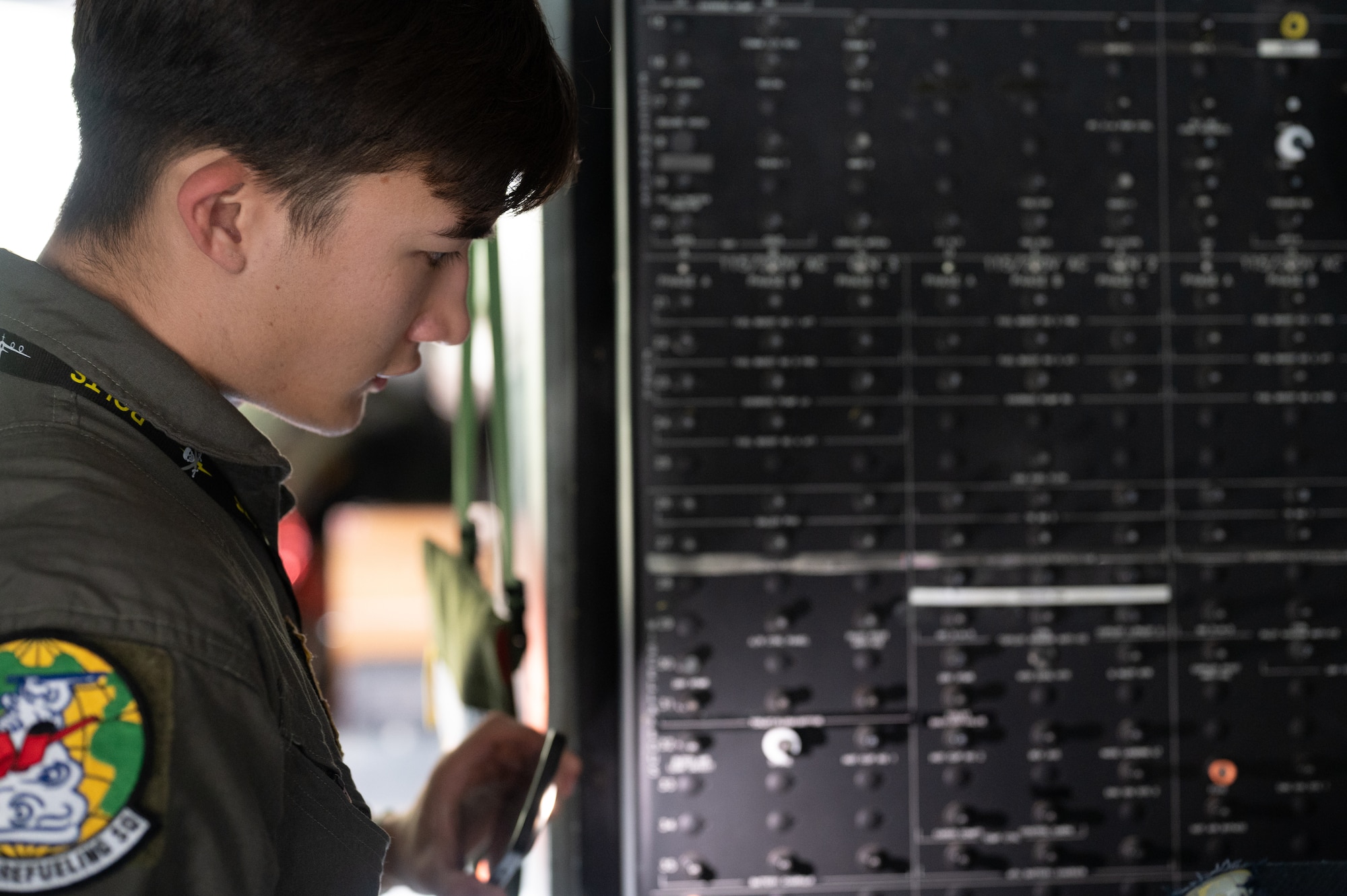 A KC-46 boom operator performs pre-flight inspections during Red Flag Alaska 23-3.