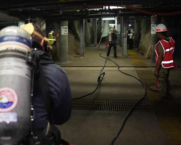 Joint Task Force-Red Hill (JTF-RH) roving security and fire watch team members respond to a simulated fire during a final exercise prior to repacking at the Red Hill Bulk Fuel Storage Facility (RHBFSF), Halawa, Hawaii, Aug. 17, 2023. JTF-RH is in phase three of its five-phase defueling plan. Personnel are focused on completing quality control tasks, training, response preparation, the National Environmental Policy Act Environmental Assessment, regulatory approvals and operational planning for all future major milestones. This extensive preparatory work will help ensure the safe and expeditious defueling of the Red Hill Bulk Fuel Storage Facility. (DoD photo by U.S. Air National Guard Tech. Sgt. Nicholas Brown)