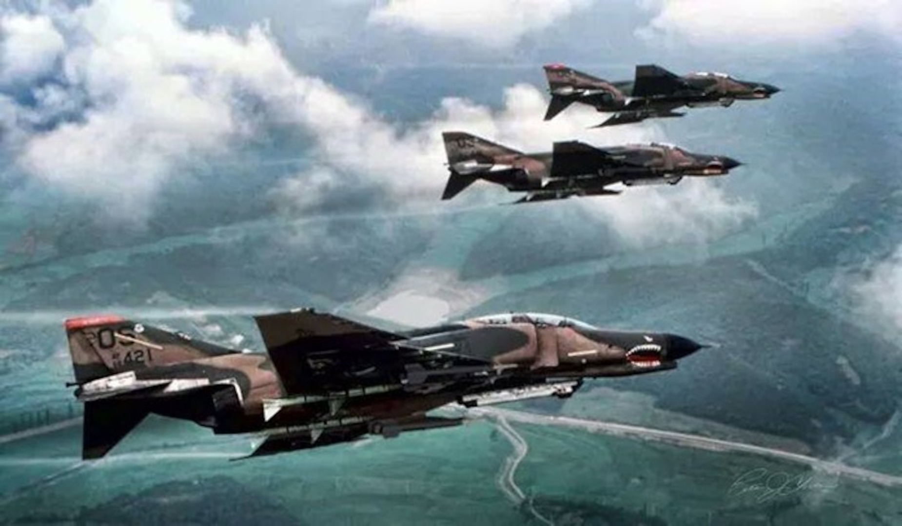 U.S. Air Force F-4 Phantom IIs fly in a formation above Osan Air Base, Republic of Korea, circa 1985. (Courtesy photo).