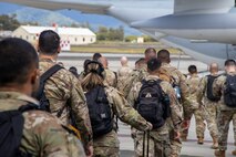 U.S. Army Soldiers with Joint Task Force 50 board a KC-130J Hercules assigned to Marine Aerial Refueler Transport Squadron 153 (VMGR-153), Marine Aircraft Group 24, 1st Marine Air Wing, at Marine Corps Air Station Kaneohe Bay, Marine Corps Base Hawaii, August 14, 2023. At the request of U.S. Army Pacific, and in accordance with U.S. federal law, Hawaii based U.S. Marines with VMGR-153 provided transportation to Joint Task Force 50 personnel and equipment from Oahu to Maui. Joint Task Force 50 is the command and control element which will coordinate DoD response efforts upon request from appropriate government authorities. (U.S. Marine Corps photo by Lance Cpl. Logan Beeney)