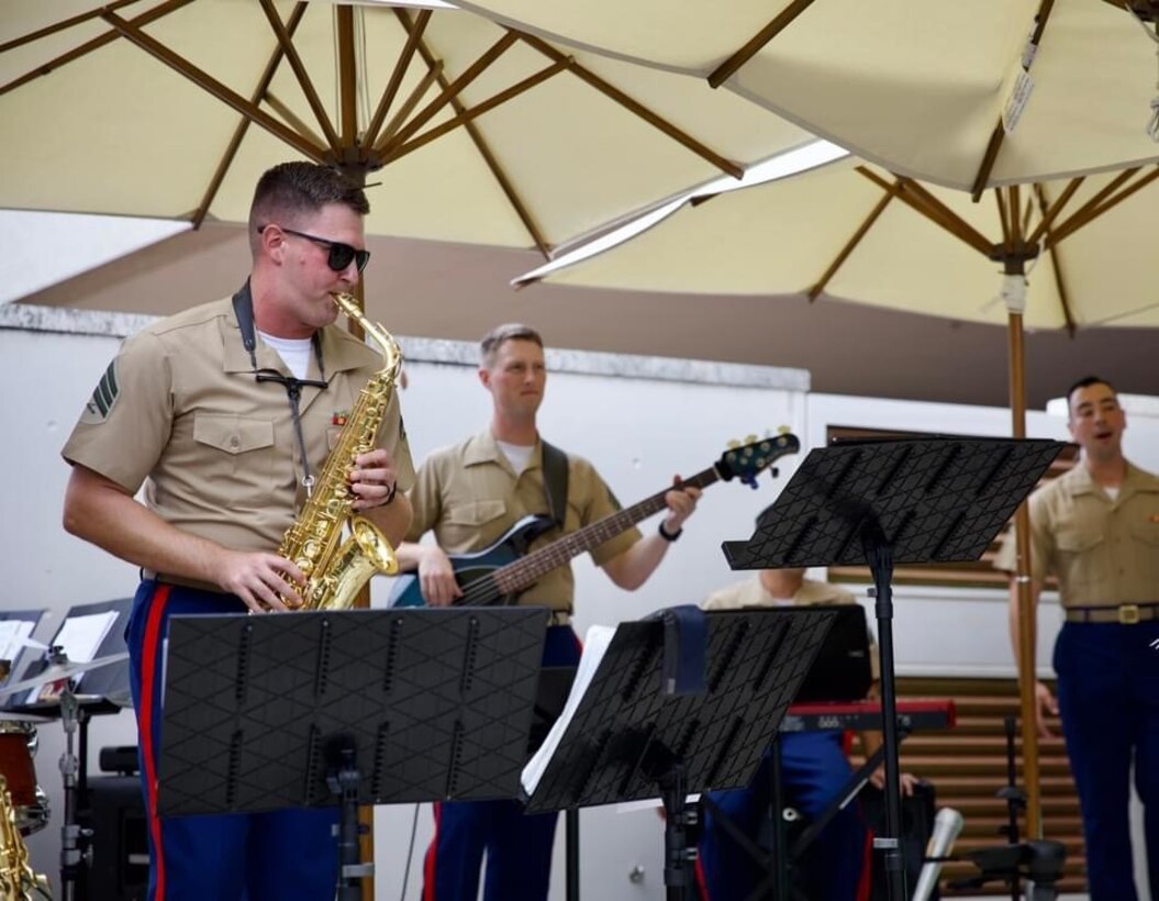 The III Marine Expeditionary Force Band performs for The American Chamber of Commerce in Japan's 4th of July Celebration at the Hilton in American Village in Okinawa, Japan. The band delivered an evening full of jazz standards and classic patriotic tunes for the audience of distinguished guests.