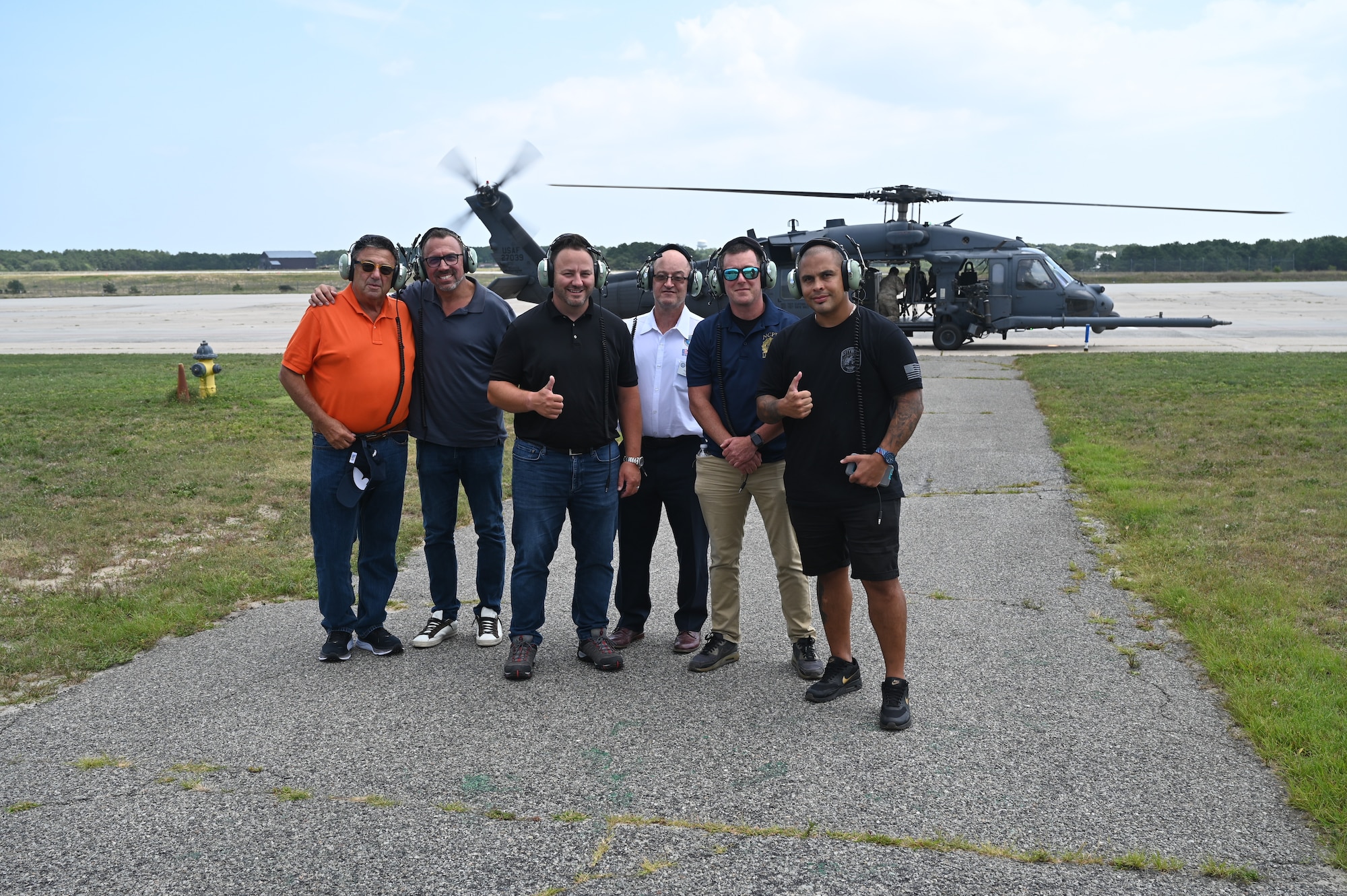 Civilian employers of members of the New York National Guard pose for a photo after a flight in an HH-60G Pave Hawk helicopter at the 106th Rescue Wing, Westhampton Beach, N.Y., Aug. 5, 2023. The 106th Rescue Wing welcomed Guardsmen’s civilian employers on base as part of “Bosslift,” an event sponsored by the Employee Support of the Guard and Reserve program.