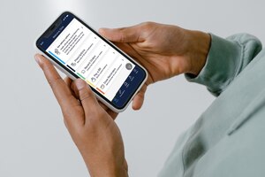 Closeup of a hands holding a smartphone with the Express Scripts app on the screen