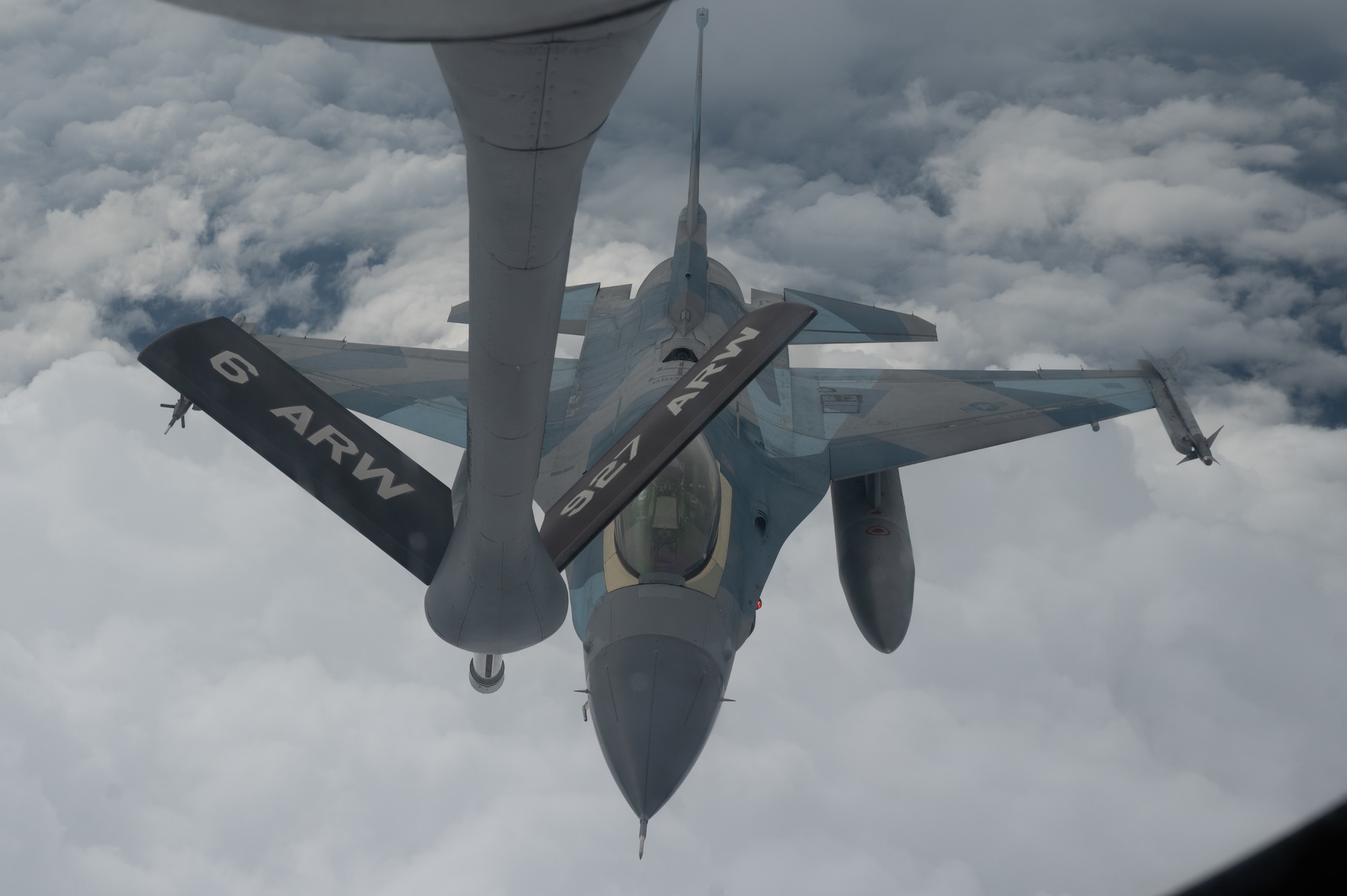 U.S. Air Force F-16 Fighting Falcon, assigned to the 18th Aggressor Squadron, Eielson Air Force Base, flies in for a refueling from a KC-135 Stratotanker assigned to the 168th Air Refueling Squadron over Joint Pacific-Alaska Range Complex during Red Flag-Alaska 23-3, Aug. 15, 2023.