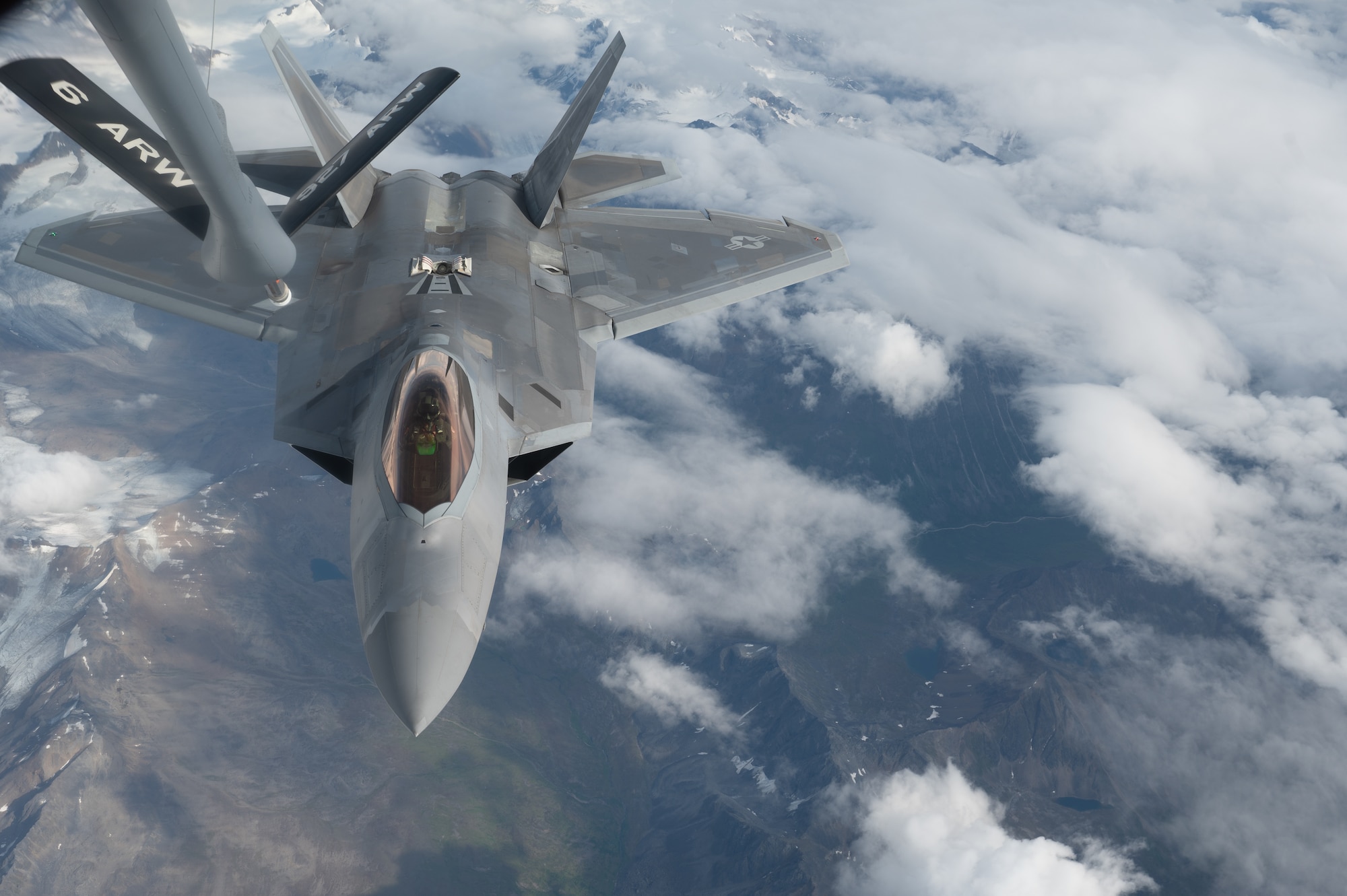 A U.S. Air Force F-22 Raptor assigned to the 3rd Wing at Joint Base Elmendorf-Richardson flies in for a refueling from a KC-135 Stratotanker assigned to the 168th Air Refueling Squadron over Joint Pacific-Alaska Range Complex during Red Flag-Alaska 23-3, Aug. 15, 2023.