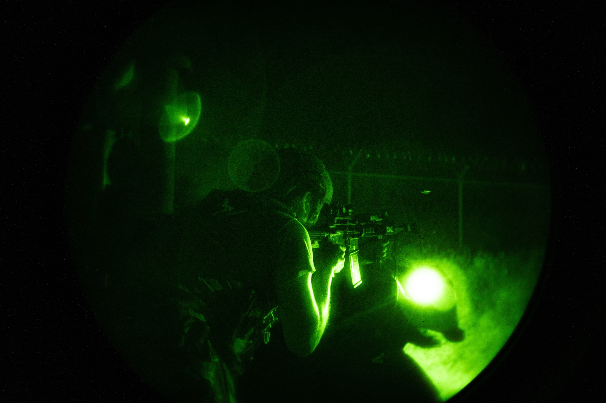 U.S. Air Force Staff Sgt. Gabriel Santiago, 51st Security Forces Squadron Defender, engages opposing forces (OPFOR) during a simulated ground attack at Osan AB, Republic of Korea, Aug. 3, 2023. The ground attacks provided crucial hands-on training for Airmen, sharpening their combat skills and improving overall situational awareness. (U.S. Air Force photo by Staff Sgt. Thomas Sjoberg)