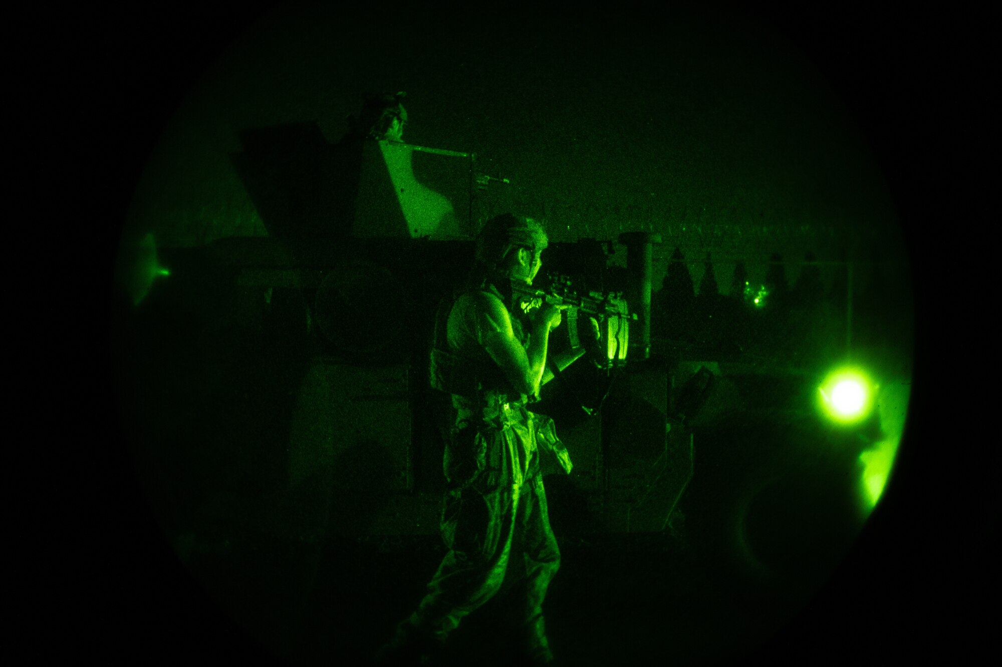 U.S. Air Force Airman 1st Class Schroeder Hopwood, left, and Staff Sgt. Gabriel Santiago, 51st Security Forces Squadron Defenders, engage opposing forces (OPFOR) during a simulated ground attack at Osan AB, Republic of Korea, Aug. 3, 2023. The training enables Airmen to develop effective response strategies and enhance their readiness for potential real-world scenarios. (U.S. Air Force photo by Staff Sgt. Thomas Sjoberg)