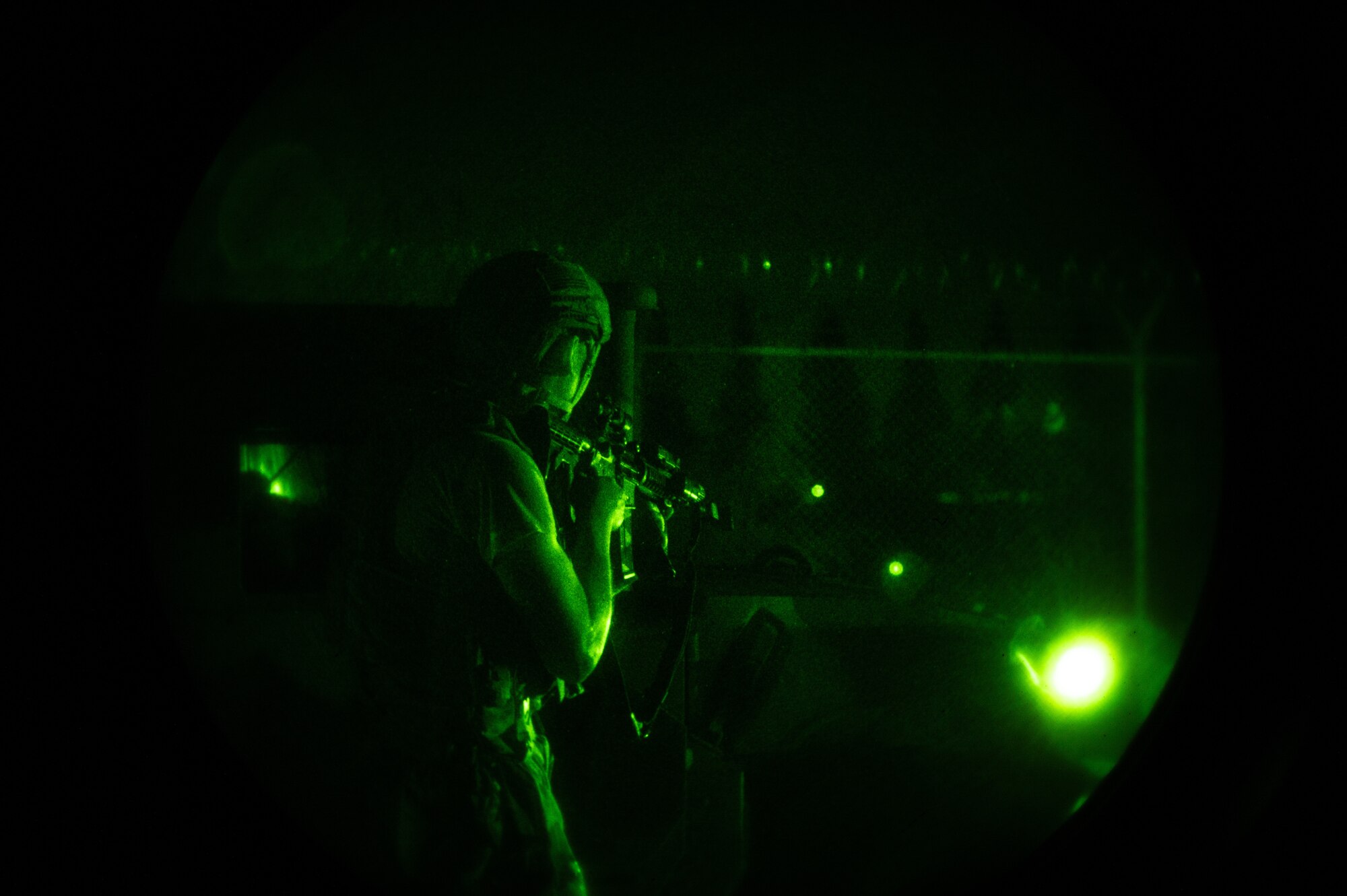 U.S. Air Force Staff Sgt. Gabriel Santiago, 51st Security Forces Squadron Defender, engages opposing forces (OPFOR) during a simulated ground attack at Osan AB, Republic of Korea, Aug. 3, 2023. The ground attacks provided crucial hands-on training for Airmen, sharpening their combat skills and improving overall situational awareness. (U.S. Air Force photo by Staff Sgt. Thomas Sjoberg)