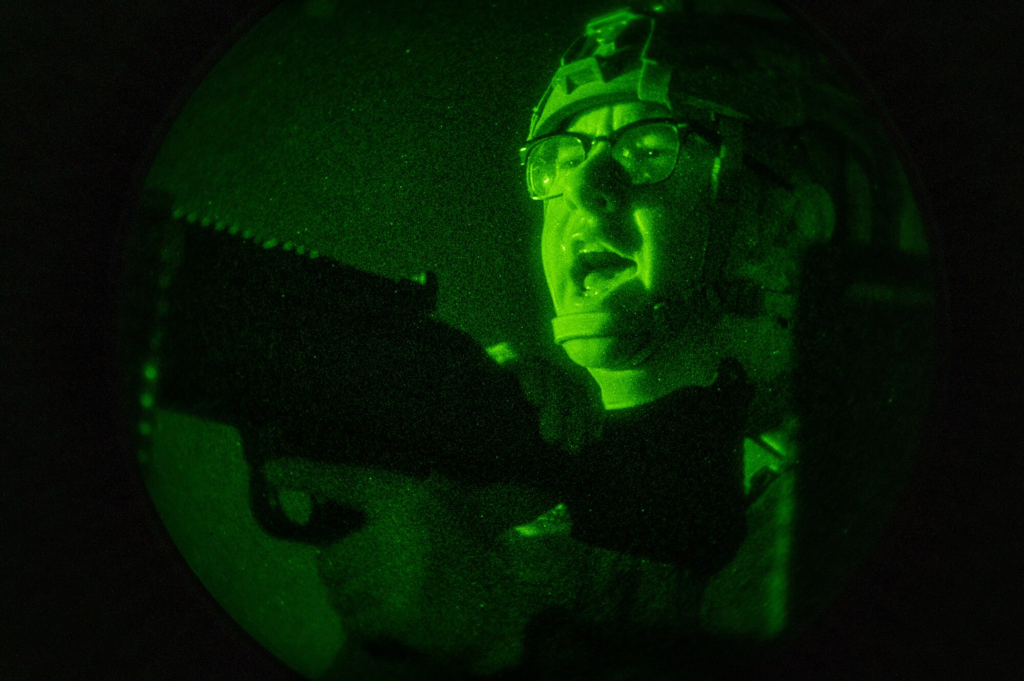 U.S. Air Force Airman 1st Class Schroeder Hopwood, 51st Security Forces Squadron Defender, shouts orders at opposing forces (OPFOR) during a simulated ground attack at Osan AB, Republic of Korea, Aug. 3, 2023. By conducting these scenarios, Osan AB fosters a culture of continuous improvement, empowering Airmen to adapt and excel in challenging ground-based training. (U.S. Air Force photo by Staff Sgt. Thomas Sjoberg)