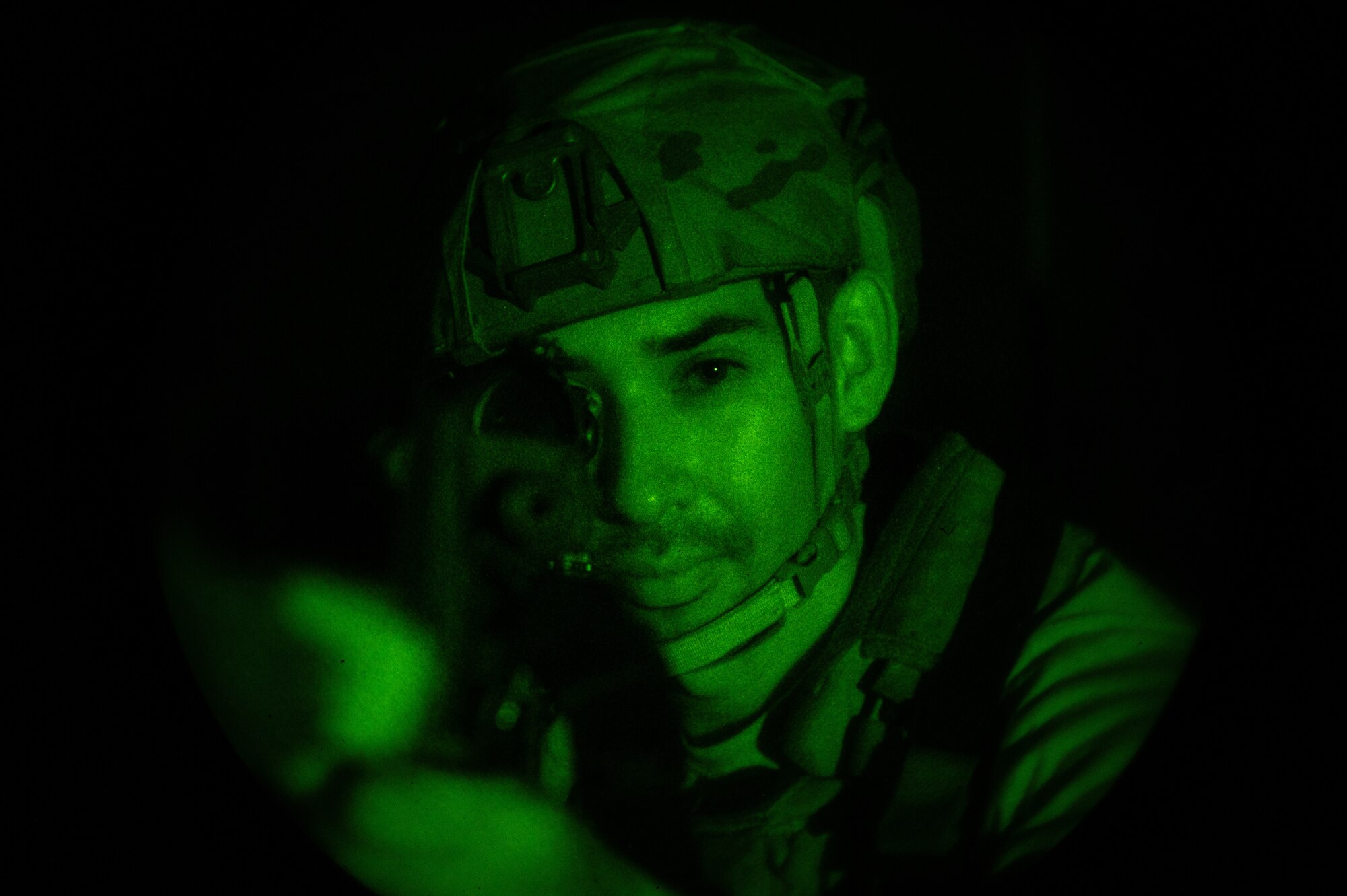 U.S. Air Force Staff Sgt. Gabriel Santiago, 51st Security Forces Squadron Defender, scans the area for opposing forces (OPFOR) during a simulated ground attack at Osan AB, Republic of Korea, Aug. 3, 2023. During the attack, Santiago assumed the role of the response force leader, strategically guiding his team through crucial response decisions. (U.S. Air Force photo by Staff Sgt. Thomas Sjoberg)