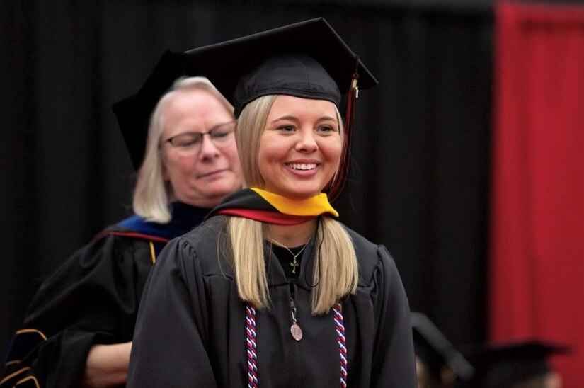 U.S. Army 1st Lt. Mickayla Grow, assigned to the 108th Area Support Medical Company, 213th Regional Support Group, speaks at the East Stroudsburg University graduate commencement ceremony, May 5, 2023. (Courtesy Photo)