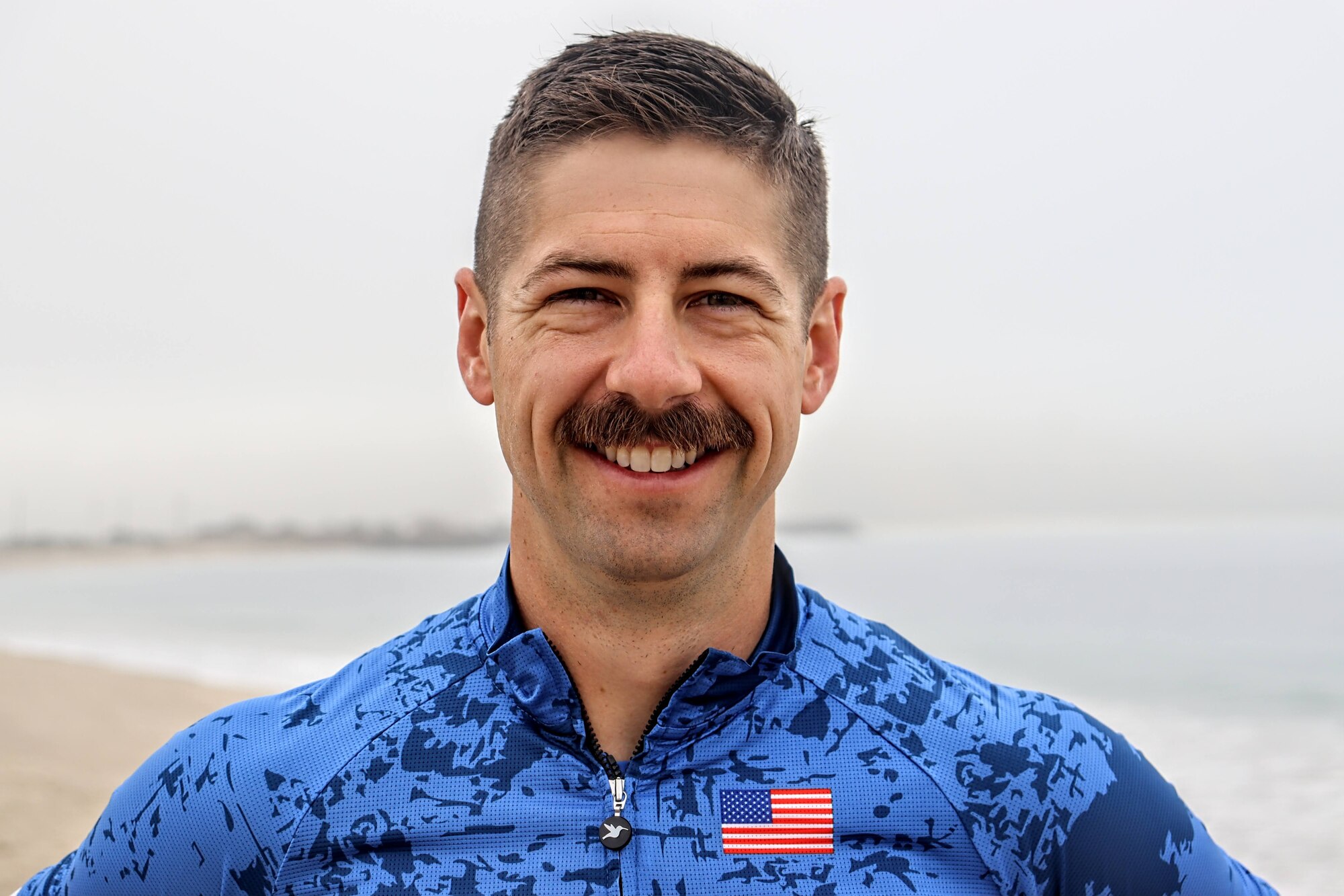 U.S. Air Force Master Sgt. Joshua Johnson, first sergeant, 233d Space Group, Greeley, Colo., stands for a photo at the Armed Forces Triathlon Championship race at Naval Air Station Point Mugu, California, June 10, 2022. Johnson completed the race after training the day before. (Photo by Lt. Col. Kenneth Corigliano)