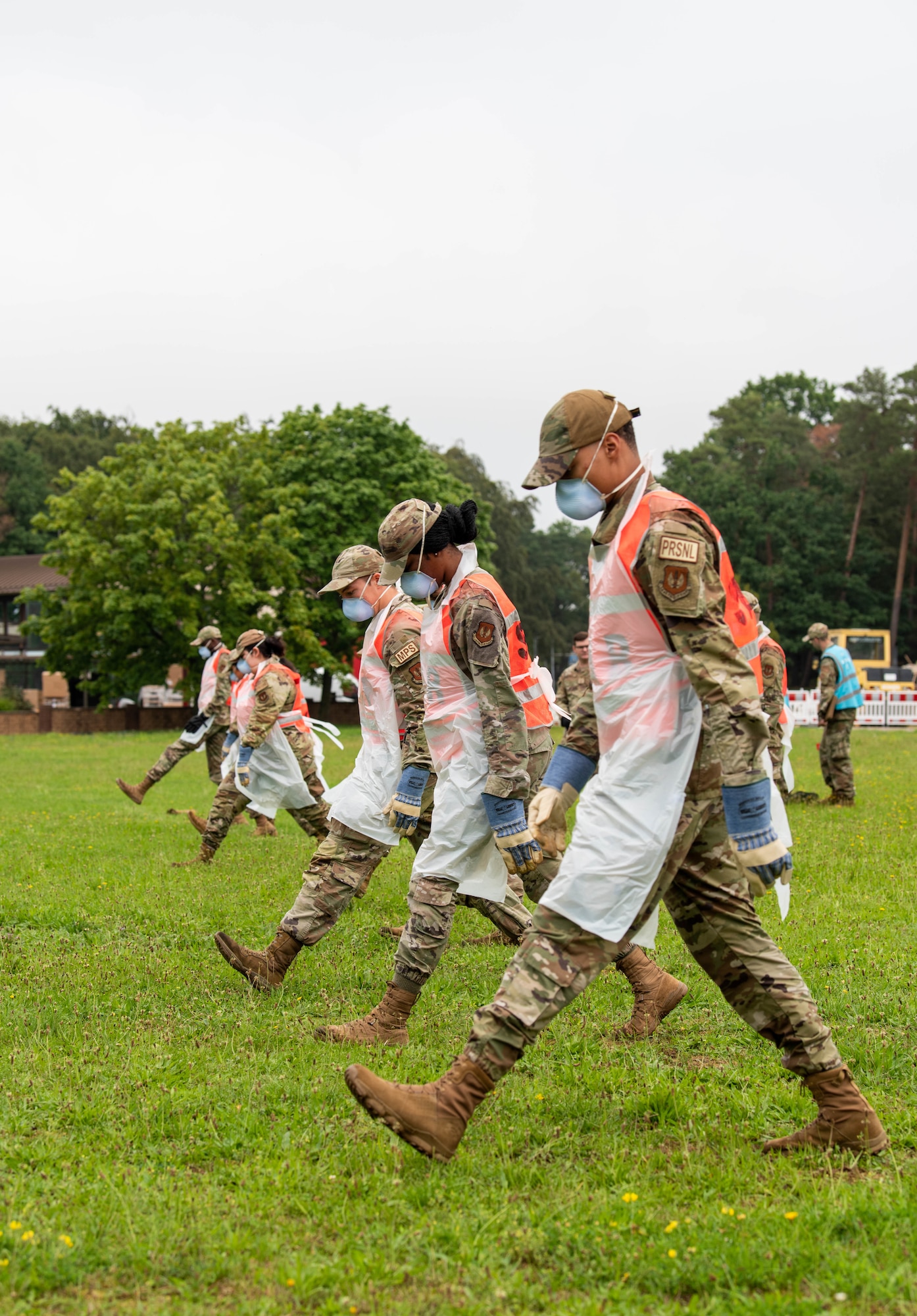 Airmen search field for debris.