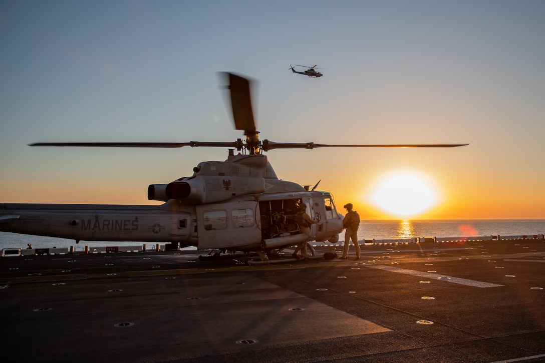 U.S. Marines with the 26th Marine Expeditionary Unit (Special Operations Capable) (MEU(SOC)), board a UH-1Y Venom during a defense of amphibious task force (DATF) rehearsal aboard amphibious assault ship USS Bataan (LHD 5), Red Sea, Aug. 7, 2023. The DATF rehearsal is conducted to provide full security to a ship during strait transit or when the ship is bound by land on both port and starboard sides. The Bataan Amphibious Group and embarked 26th MEU(SOC), under the command and control of Task Force 51/5, is on a scheduled deployment in the U.S. Naval Forces Central Command area of operations, employed by U.S. Fifth Fleet to maintain maritime security and stability in the Middle East region. (U.S. Marine Corps photo by Cpl. Nayelly Nieves-Nieves)