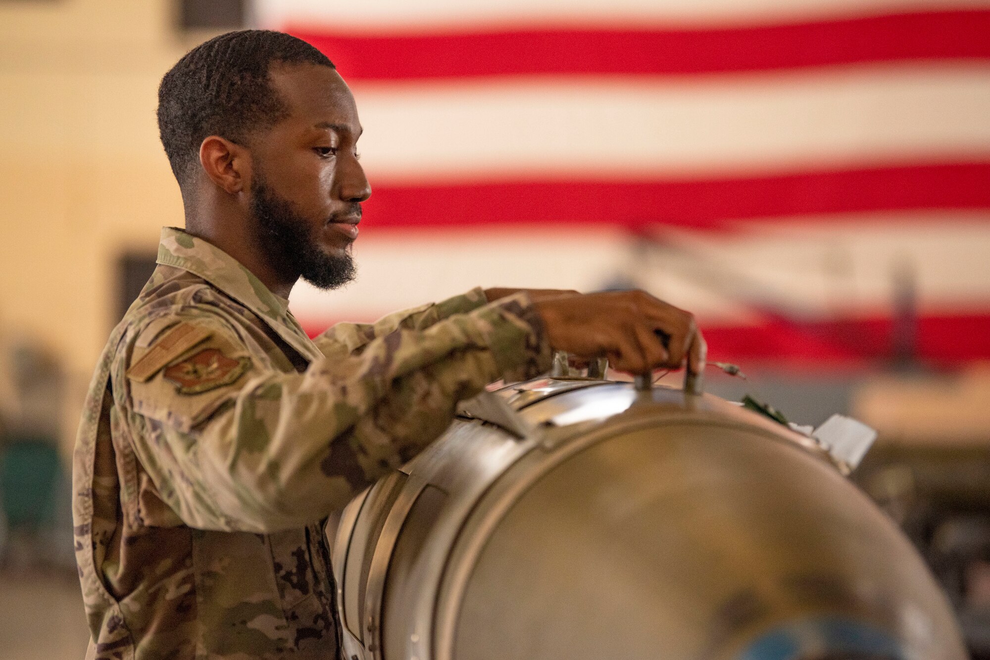 U.S. Air Force Senior Airman Ellod Richardson, 23rd Maintenance Group Weapons Standardization Section instructor, inspects a training GBU-31 V1 during a routine munitions training inspection at Moody Air Force Base, Georgia, August 15, 2023. New weapons Airmen are taught to load munitions onto A-10C Thunderbolt II aircraft during 6-day initial certification courses. (U.S. Air Force photo by Staff Sgt. Thomas Johns)