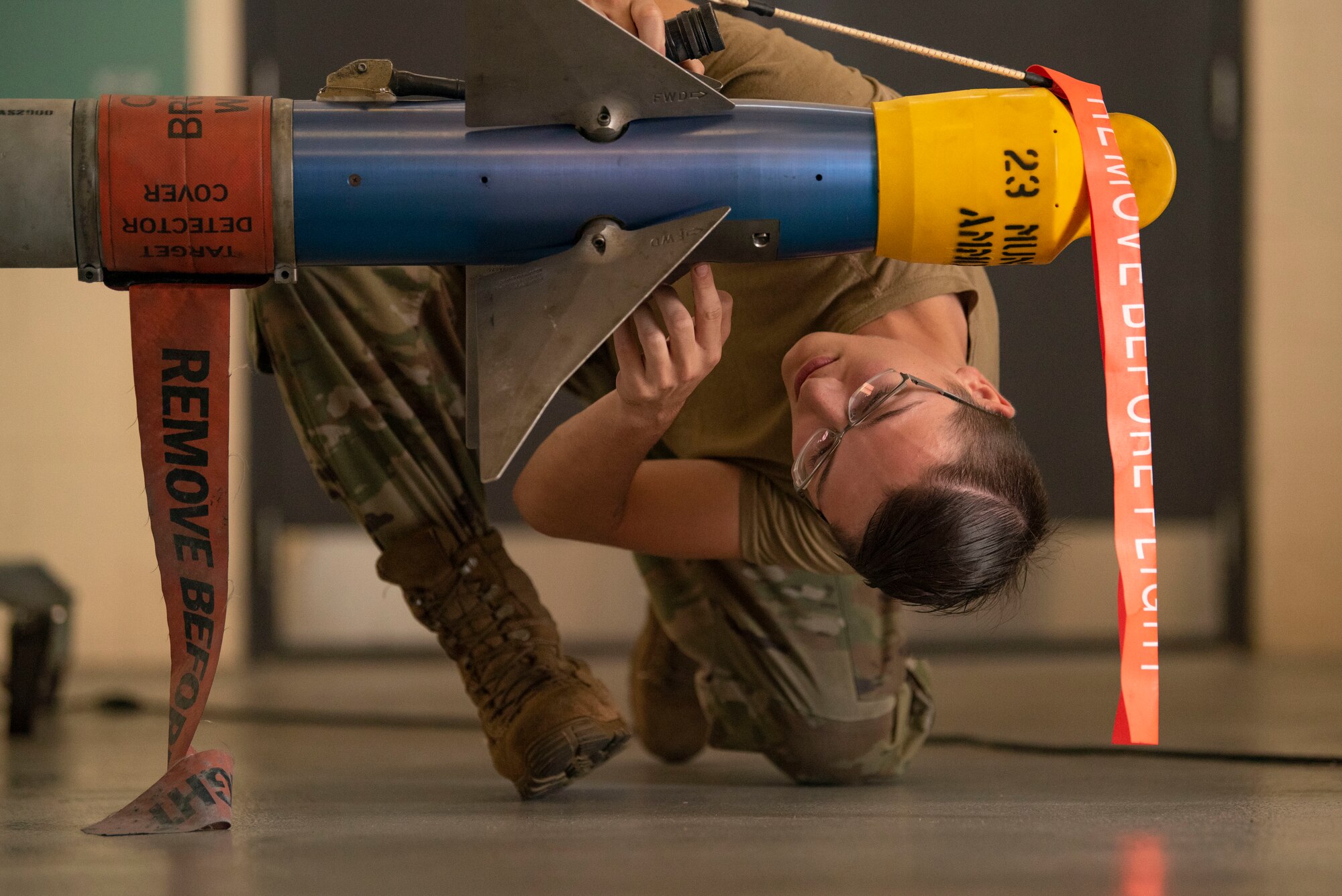 U.S. Senior Airman Kyle Cauthen, 74th Fighter Group weapons load crew member, inspects a training AIM-9 Missile during a routine munitions training inspection at Moody Air Force Base, Georgia, August 15, 2023. Regular munitions inspection training prepares weapons Airmen to safely load munitions onto aircraft in any situation. (U.S. Air Force photo by Staff Sgt. Thomas Johns)