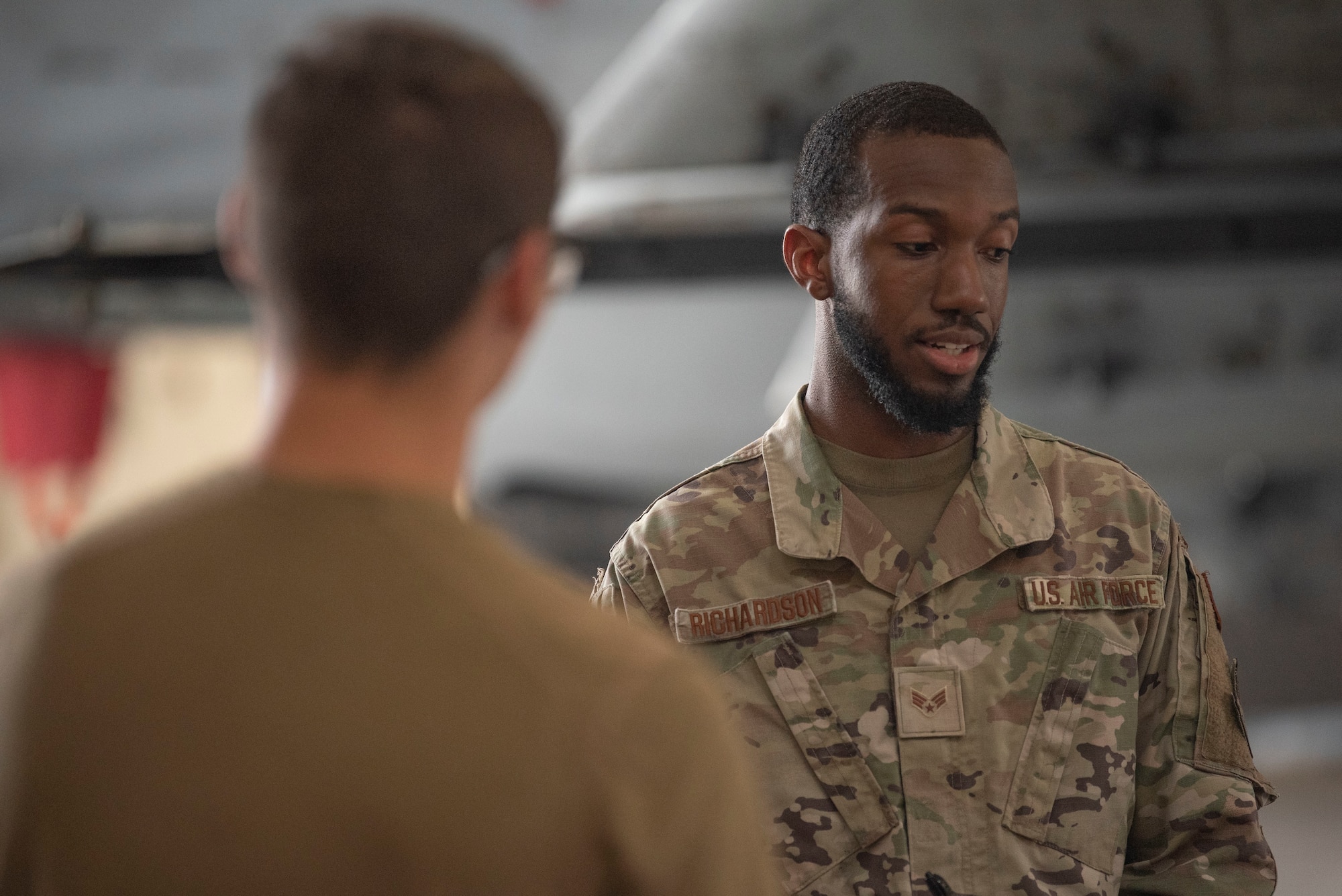 U.S. Air Force Senior Airman Ellod Richards, 23rd Maintenance Group Weapons Standardization Section instructor grades a weapons trainee during a routine munitions training inspection at Moody Air Force Base, Georgia, August 15, 2023. During a six-day initial certification course, weapons Airmen are taught to inspect, prepare, and load munitions before combat employment. (U.S. Air Force photo by Staff Sgt. Thomas Johns)