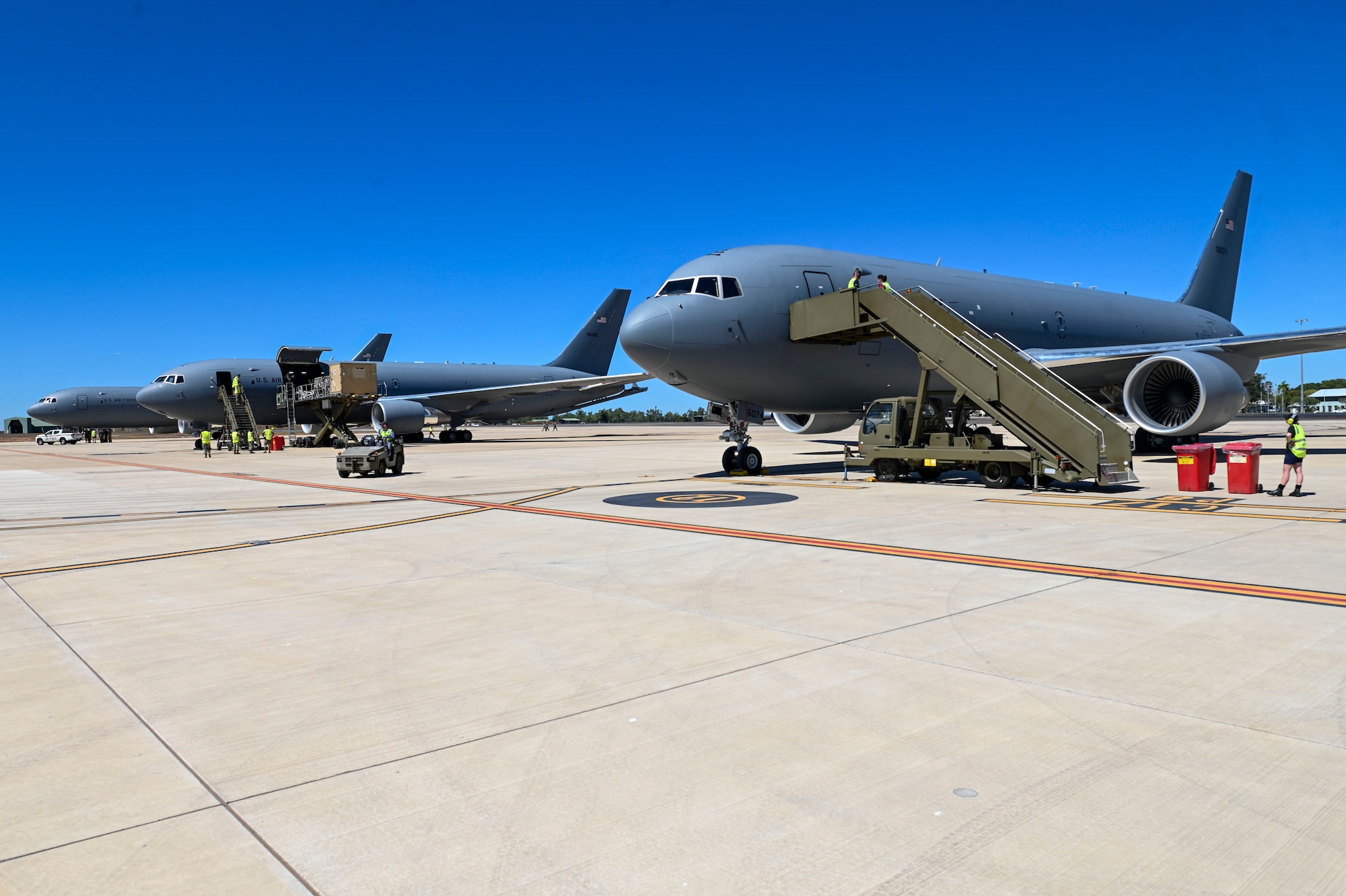 Royal Australian Air Force and 92nd Expeditionary Wing personnel prepare to get multiple KC-46 Pegasus airborne for Mobility Guardian 23 in Darwin, Australia, on July 9, 2023. A multinational endeavor, MG23 featured seven participating countries – Australia, Canada, France, Japan, New Zealand, the United Kingdom, and the United States – operating nearly 70 mobility aircraft across multiple locations spanning a 3,000-mile area in the Indo-Pacific. (U.S. Air Force photo by Airman 1st Class Haiden Morris)