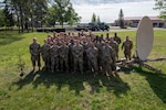 U.S. Air National Guardsman with the 232nd Combat Communications Squadron, Montgomery, Alabama stand for a group photo at the Alpena Combat Readiness Training Center, Michigan, Aug. 10, 2023.