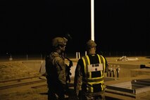 91st Missile Wing Inspector General evaluator debriefs with a defender from the 791st Missile Security Forces Squadron. (U.S. Air Force courtesy photo)