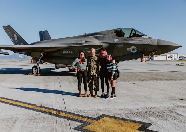 Corina Gonzalez and her family pose for a group photo in front of a U.S. Marine Corps F-35B Lightning II aircraft at Marine Corps Air Station Iwakuni, Japan. Gonzalez is a Marine Corps veteran and loving mother who volunteers at numerous organizations throughout MCAS Iwakuni, and has proven to be a diligent and dedicated member of the community.
