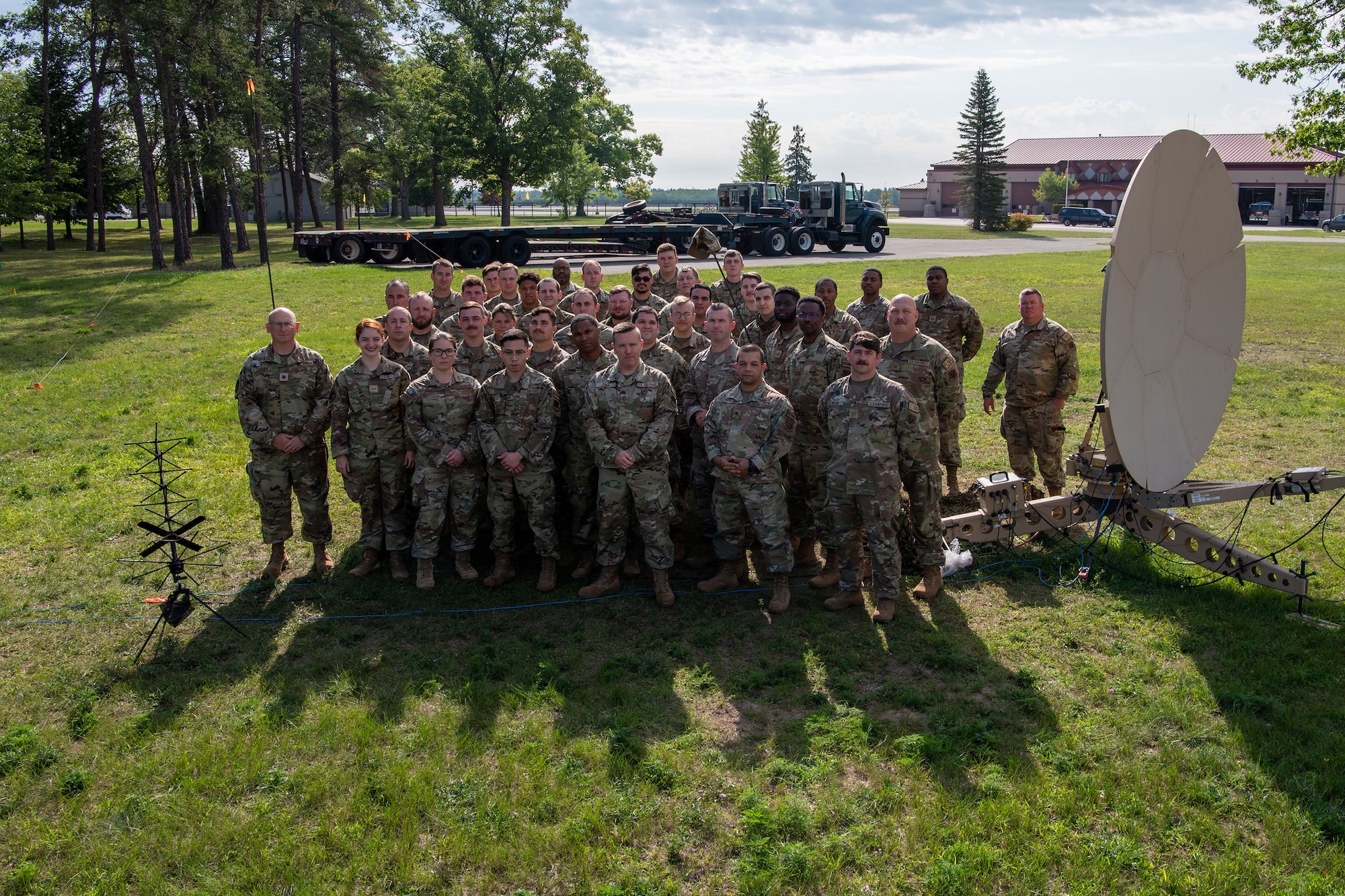 U.S. Air National Guardsman with the 232nd Combat Communications Squadron, Montgomery, Alabama stand for a group photo at the Alpena Combat Readiness Training Center, Michigan, Aug. 10, 2023.