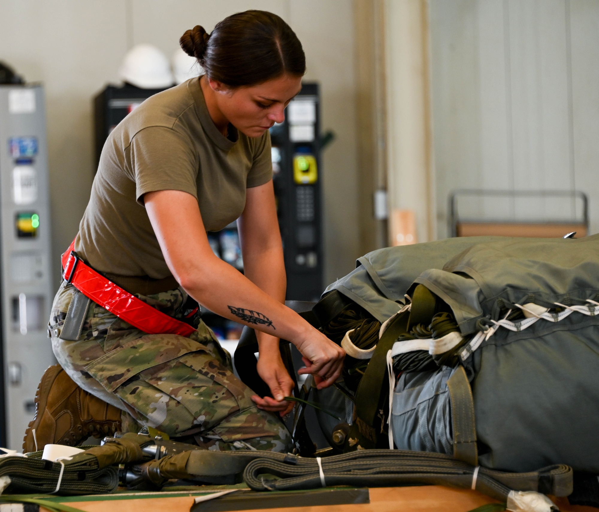 U.S. Air Force Tech. Sgt. Kaycee Clune, 97th Logistics Readiness Squadron unilateral aircrew training rigger supervisor, reconstitutes a dual row airdrop system platform at Altus Air Force Base, Oklahoma, Aug. 15, 2023. “I didn’t realize the impact that I had until one of my Senior Airmen told me that I was her first female noncommissioned officer and thanked me for leading her. That keeps me going, it feels nice not only to know that I made an impact on a young Airman, but other women in my shop know that they have someone they can relate to.” (U.S. Air Force photo by Airman 1st Class Miyah Gray)