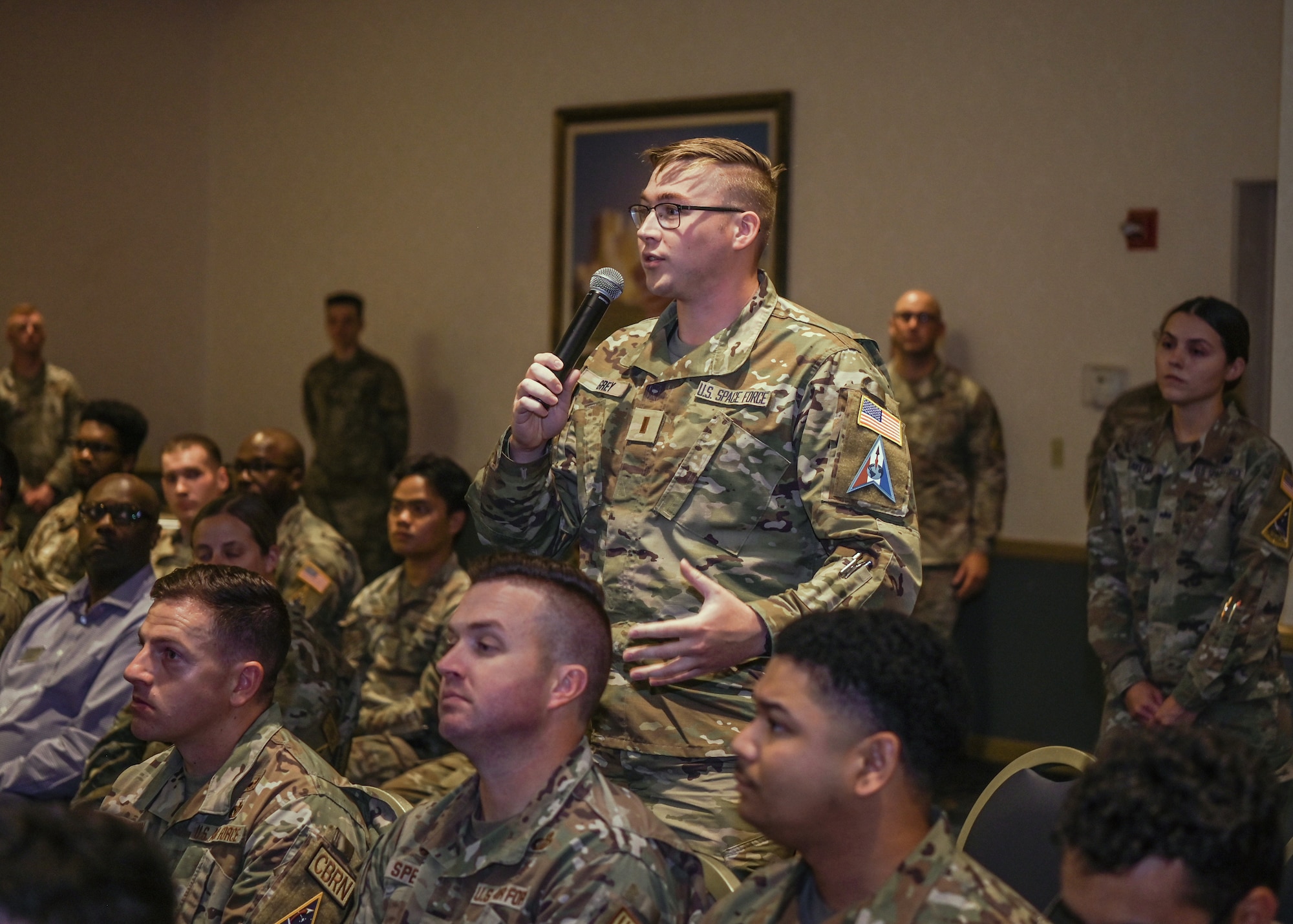 U.S. Space Force 2nd Lt. Charles Grey, 533rd Training Squadron project officer, asks Chief Master Sgt. of the Space Force Roger A. Towberman a question during his visit at Vandenberg Space Force Base, Calif., Aug. 14, 2023.