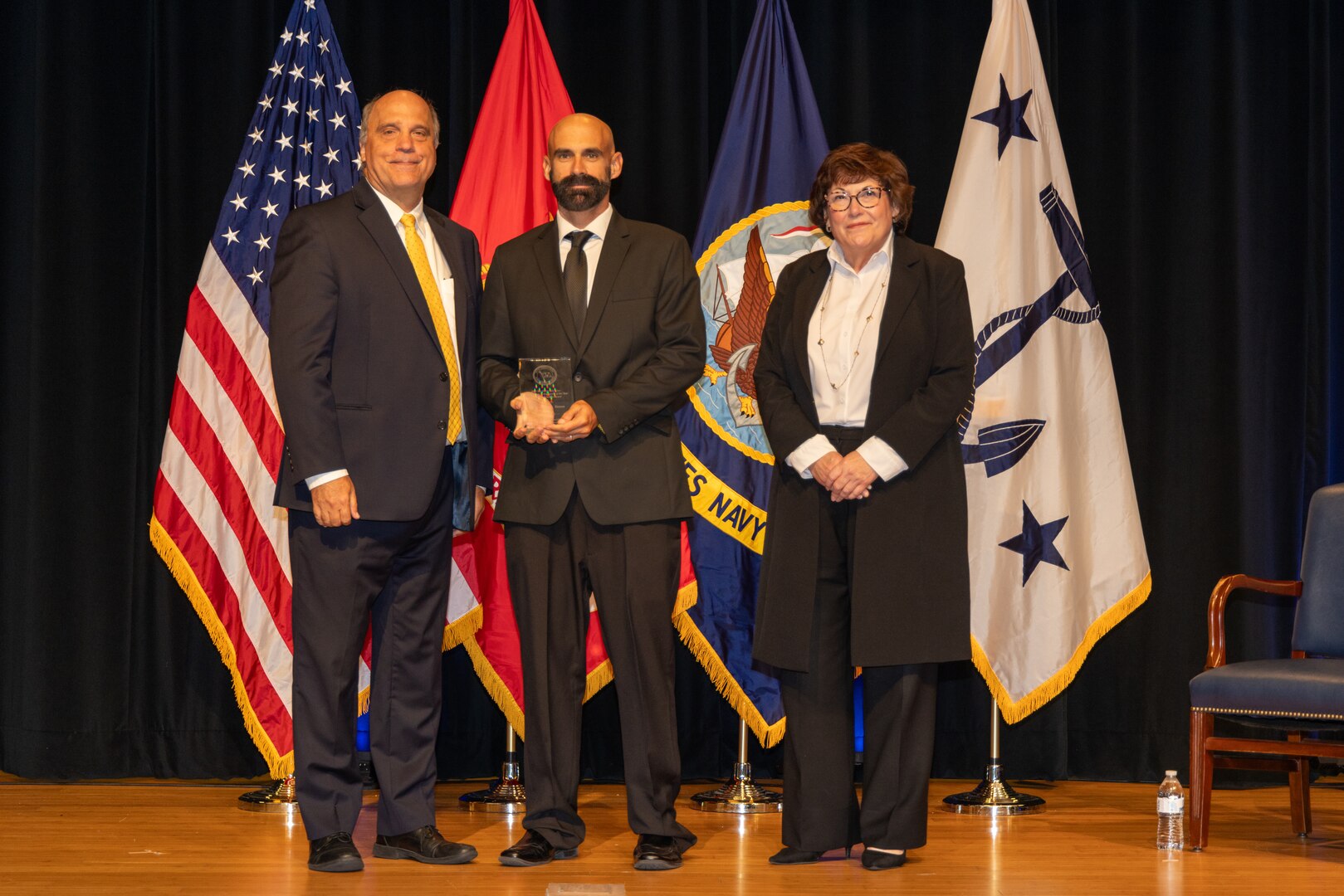 (center) Naval Surface Warfare Center Panama City Division Scientist Dr. Richard Tatum receives the 2023 Dr. Delores M. Etter Top Navy Scientists and Engineers Award. Tatum traveled to Washington to be presented the Individual Scientist Award, June 15. (courtesy photo)