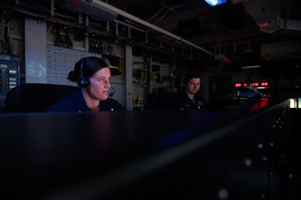 Lt. Cmdr. Christine Tyndall, from San Jose, California, and Lt. Steven McGhan, from Merritt Island, Florida, stand watch during Large-Scale Exercise (LSE) 2023 aboard the Nimitz-class aircraft carrier USS Dwight D. Eisenhower (CVN 69). LSE 2023 is a live, virtual, and constructive, globally-integrated exercise designed to refine how we synchronize maritime operations across multiple fleets, in support of the joint force