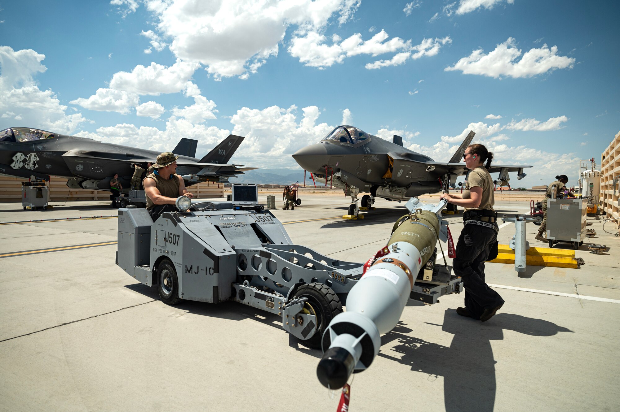 airmen load bomb