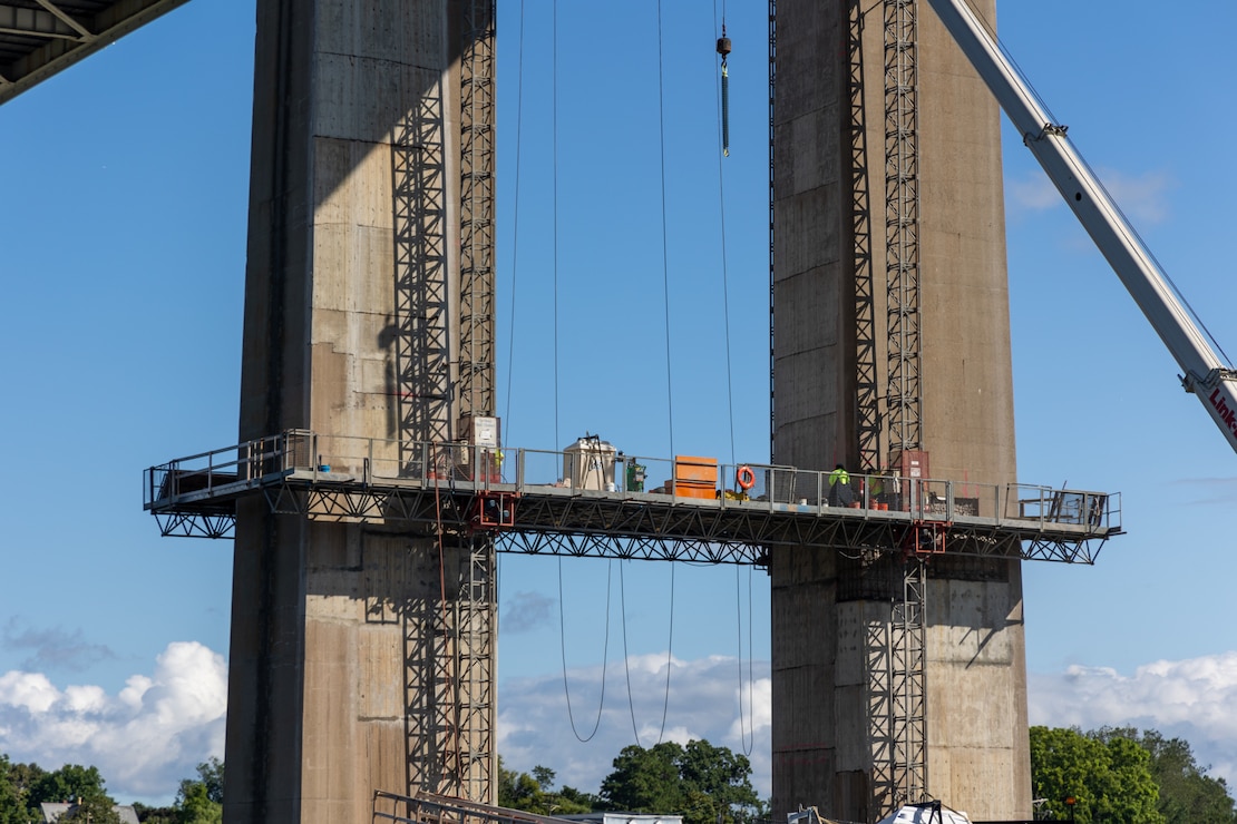 Photo shows contractors working on bridge piers