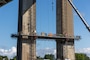 Photo shows contractors working on bridge piers