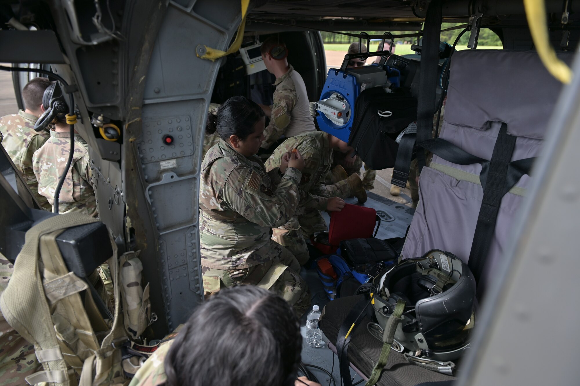 Medical personnel examine medical supplies.