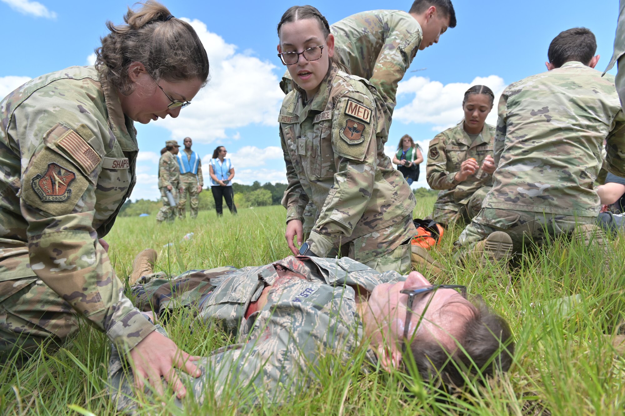 Medical personnel attend to a simulated injury.