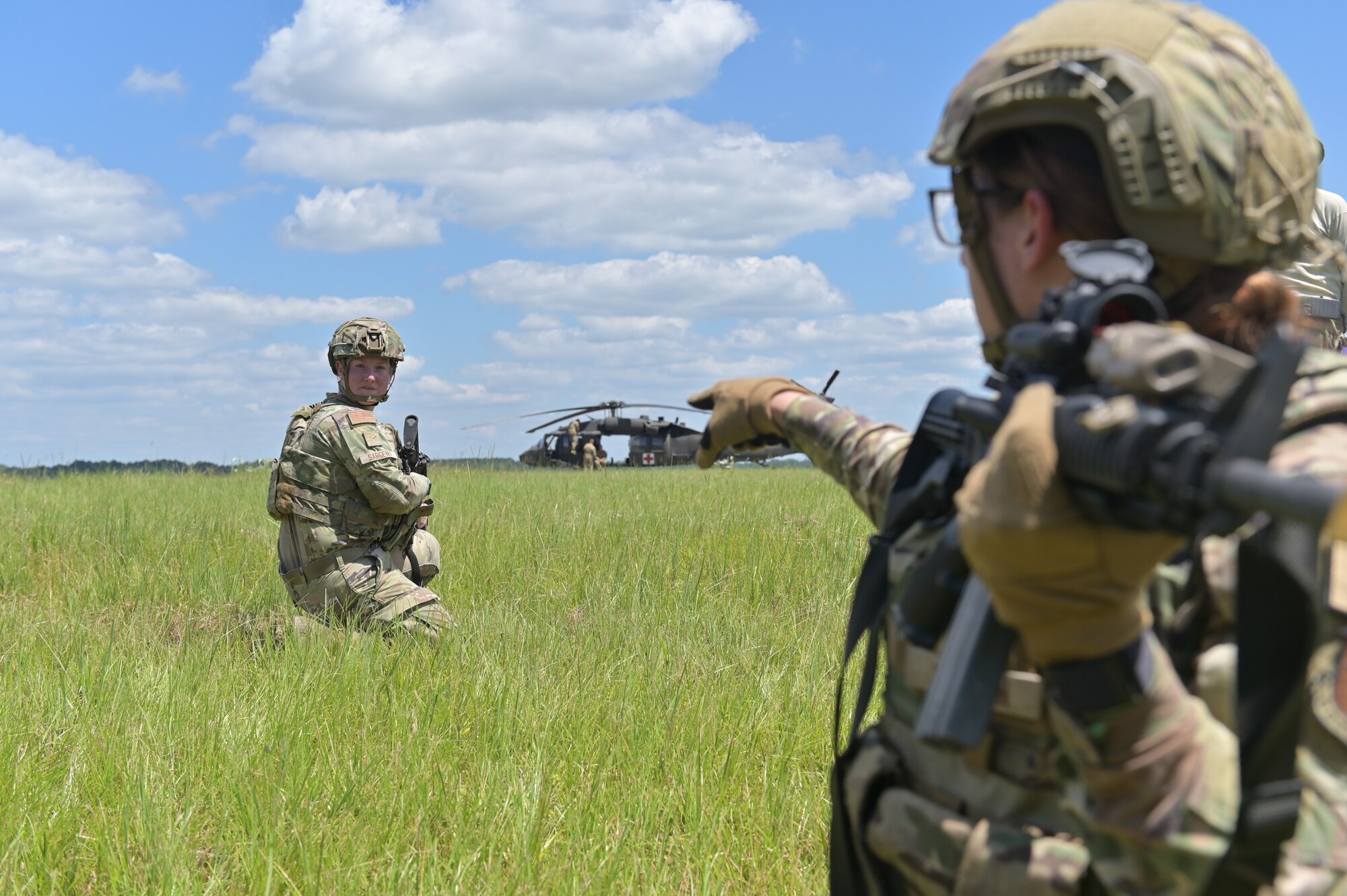 Defenders provide overwatch for medical personnel.