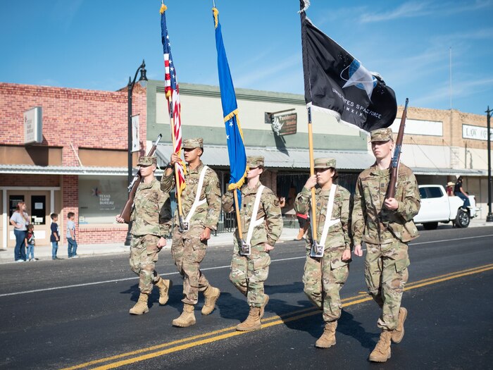 Juan Carlos Jara, Angelo State University Air Force ROTC cadet, carries the United States flag during a parade in San Angelo, Texas. Jara enlisted in the U.S. Air Force in 2016 and is now commissioning through the ROTC program at ASU. (Courtesy photo)