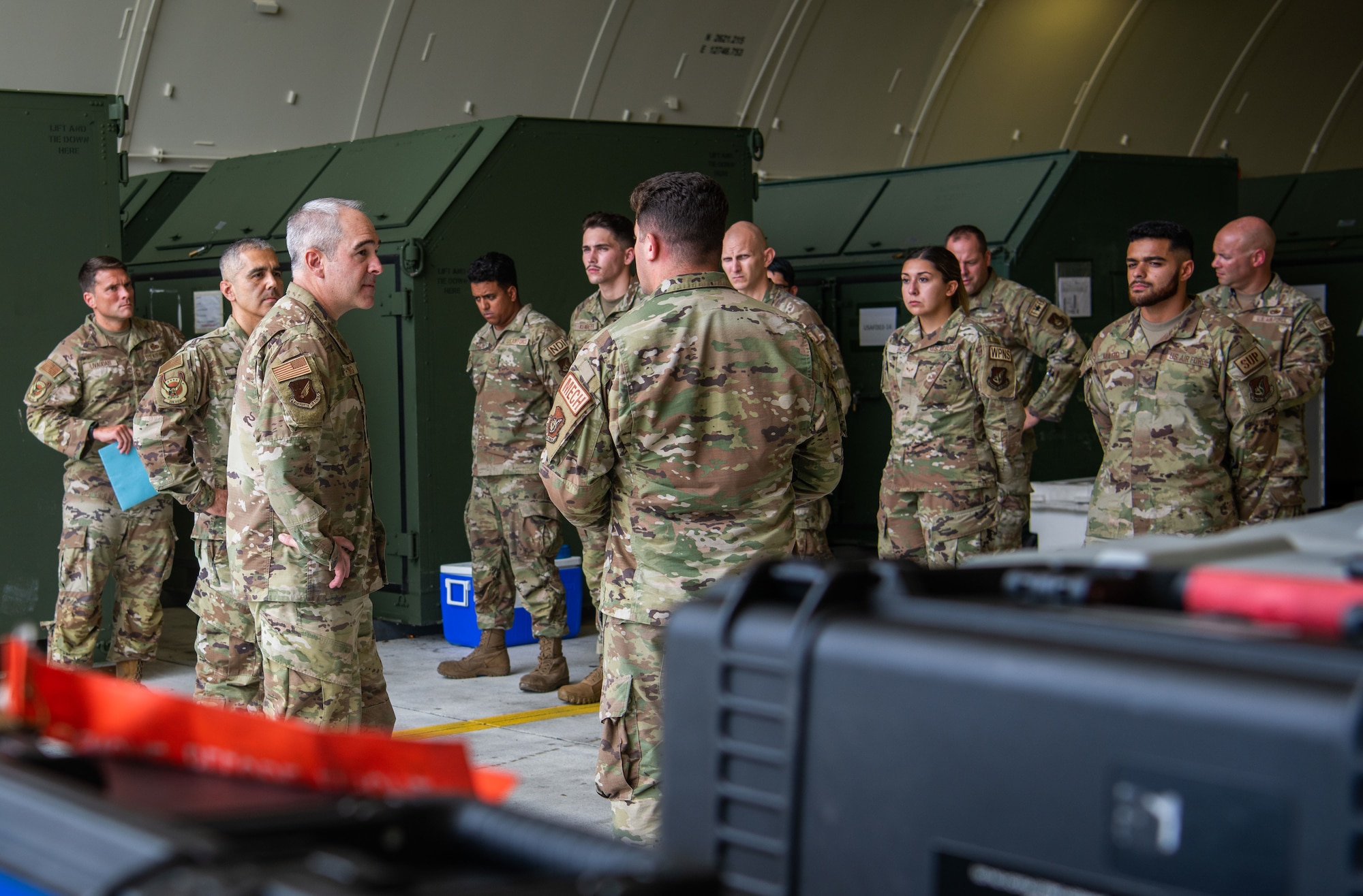 U.S. Air Force Chief Master Sgt. Kristopher Berg, 11th Air Force command chief, speaks with U.S. Air Force Airmen from the 354th Fighter Wing.