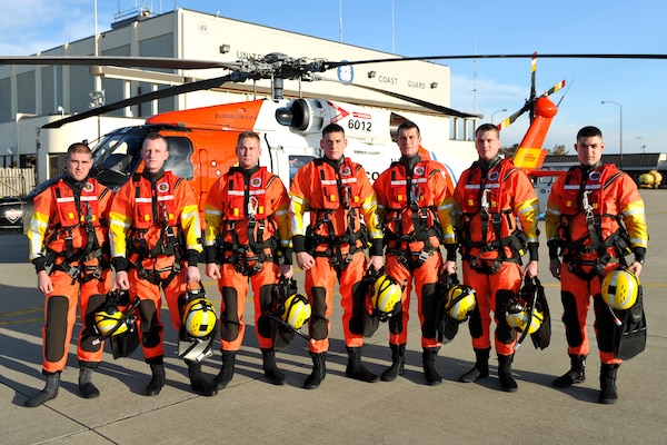 Group photograph of modern Coast Guard rescue swimmers whose program owes its founding to changes mandated after the tragic loss of the Marine Electric. (U.S. Coast Guard photo)