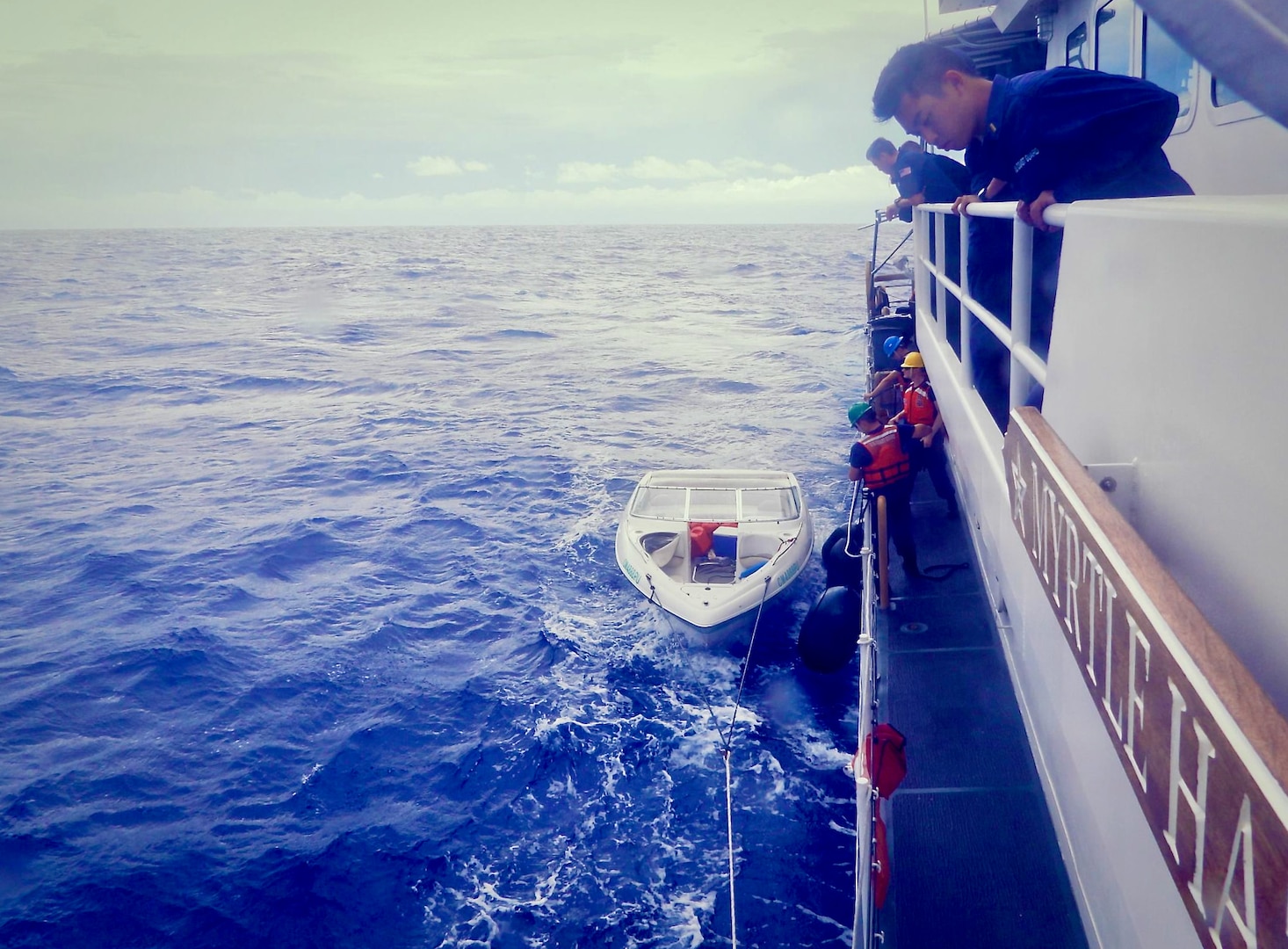 USCGC Myrtle Hazard (WPC 1139) tows a disabled vessel en route to Rota after the 11 aboard were airlifted on July 10, 2023. The crew secured evidence and transferred the boat to the CNMI Department of Public Safety and Homelands Security Investigations at the pier in Rota for further investigation. (U.S. Coast Guard photo)