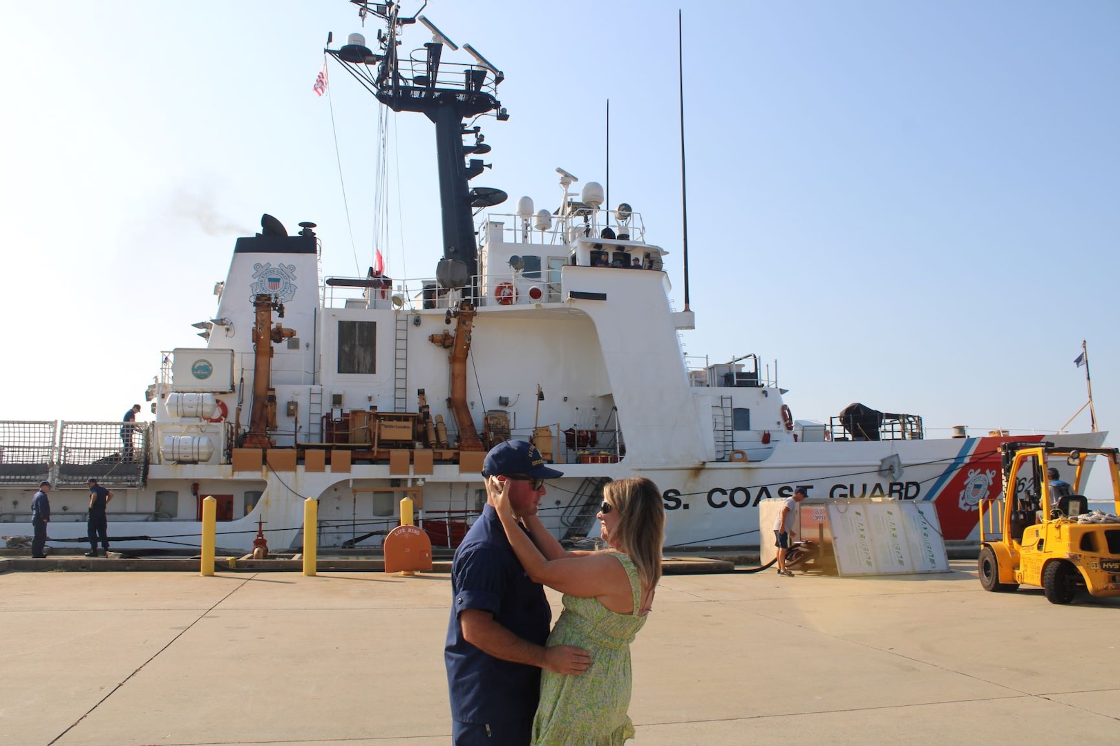 U.S. Coast Chief Petty Officer Wil Wiggins, a crew member assigned to Guard Cutter Dauntless (WMEC 624), greets his spouse at the unit's return to homeport in Pensacola, Florida, Aug. 19, 2023. The Dauntless crew completed a 42-day patrol in the Windward Passage. (U.S. Coast Guard photo by courtesy of Dauntless)