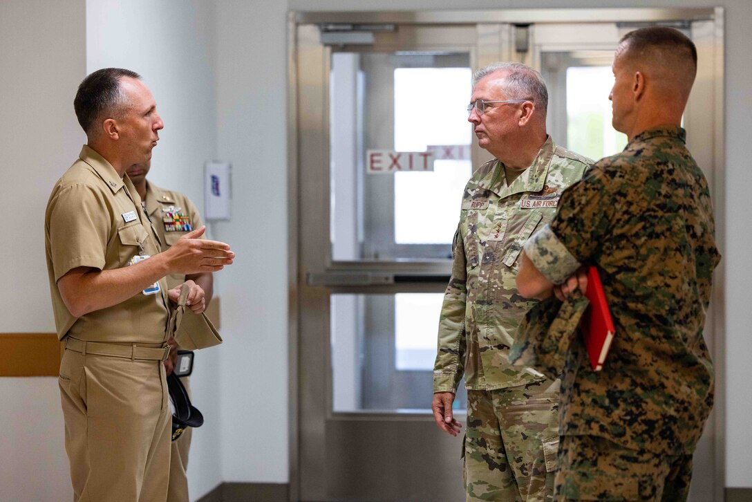U.S. Navy Capt. James Demitrack, the officer in charge of the Marine Corps Air Station Iwakuni Naval Family Branch Health Clinic, speaks with U.S. Air Force Lt. Gen. Ricky Rupp, the commander of U.S. Forces Japan, and U.S. Marine Corps Maj. Gen. Stephen Liszewski, the commanding general of Marine Corps Installations Pacific, at MCAS Iwakuni, Japan, July 28, 2023. Lt. Gen. Rupp visited the installation with Maj. Gen. Liszewski to better understand the quality of life of on-base personnel, as well as discuss with Japanese officials ways to strengthen the U.S.-Japan alliance. (U.S. Marine Corps photo by Cpl. Darien Wright)