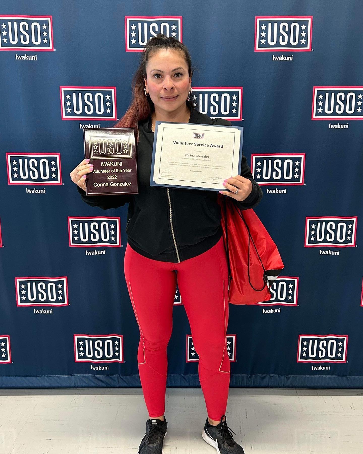 Corina Gonzalez poses for a photo with her USO volunteer of the year award at Marine Corps Air Station Iwakuni, Japan. Gonzalez is a Marine Corps veteran and loving mother who volunteers at numerous organizations throughout MCAS Iwakuni, and has proven to be a diligent and dedicated member of the community. (Courtesy photo by Corina Gonzalez)